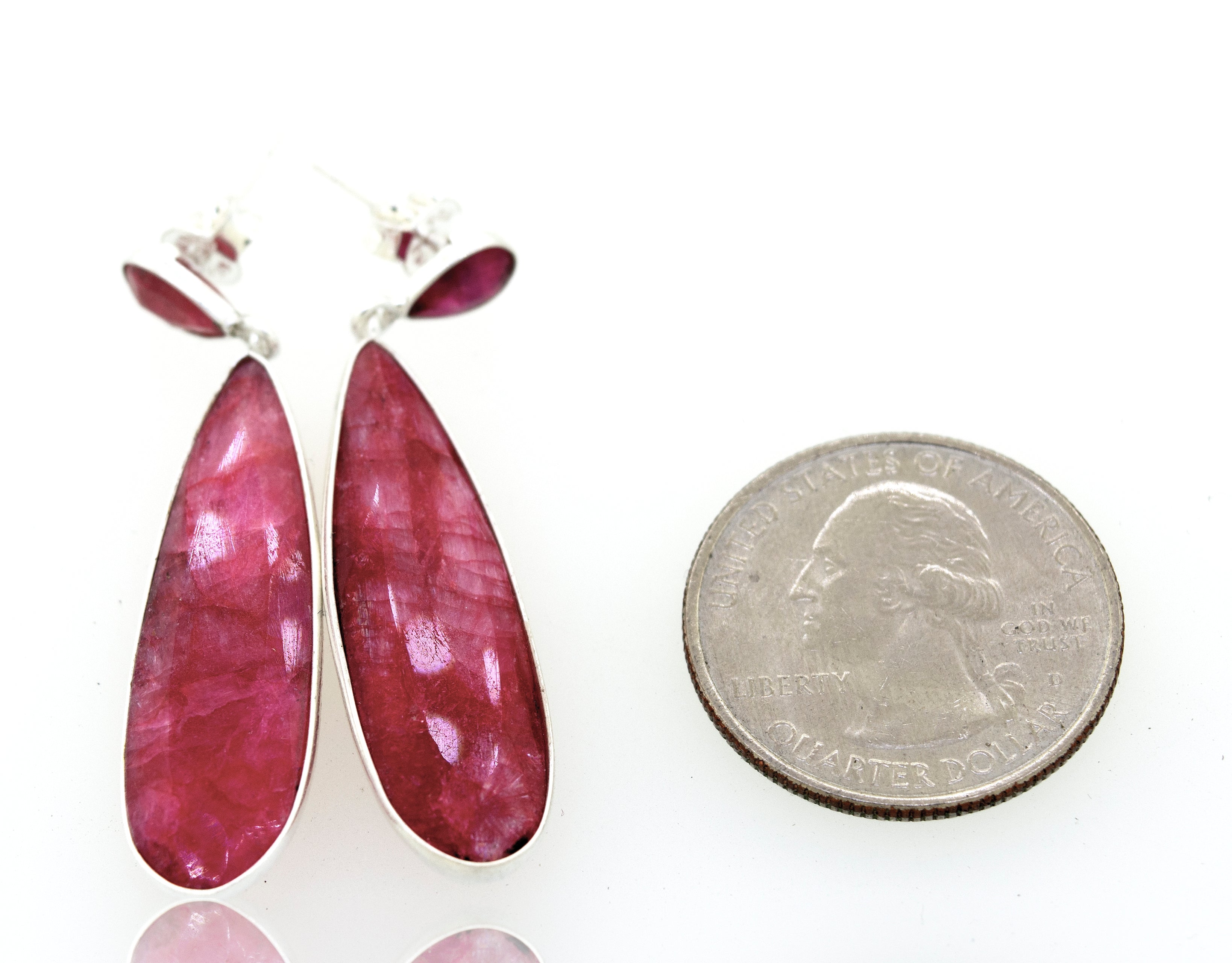 A pair of Super Silver Vibrant Teardrop Shape Emerald Earrings.