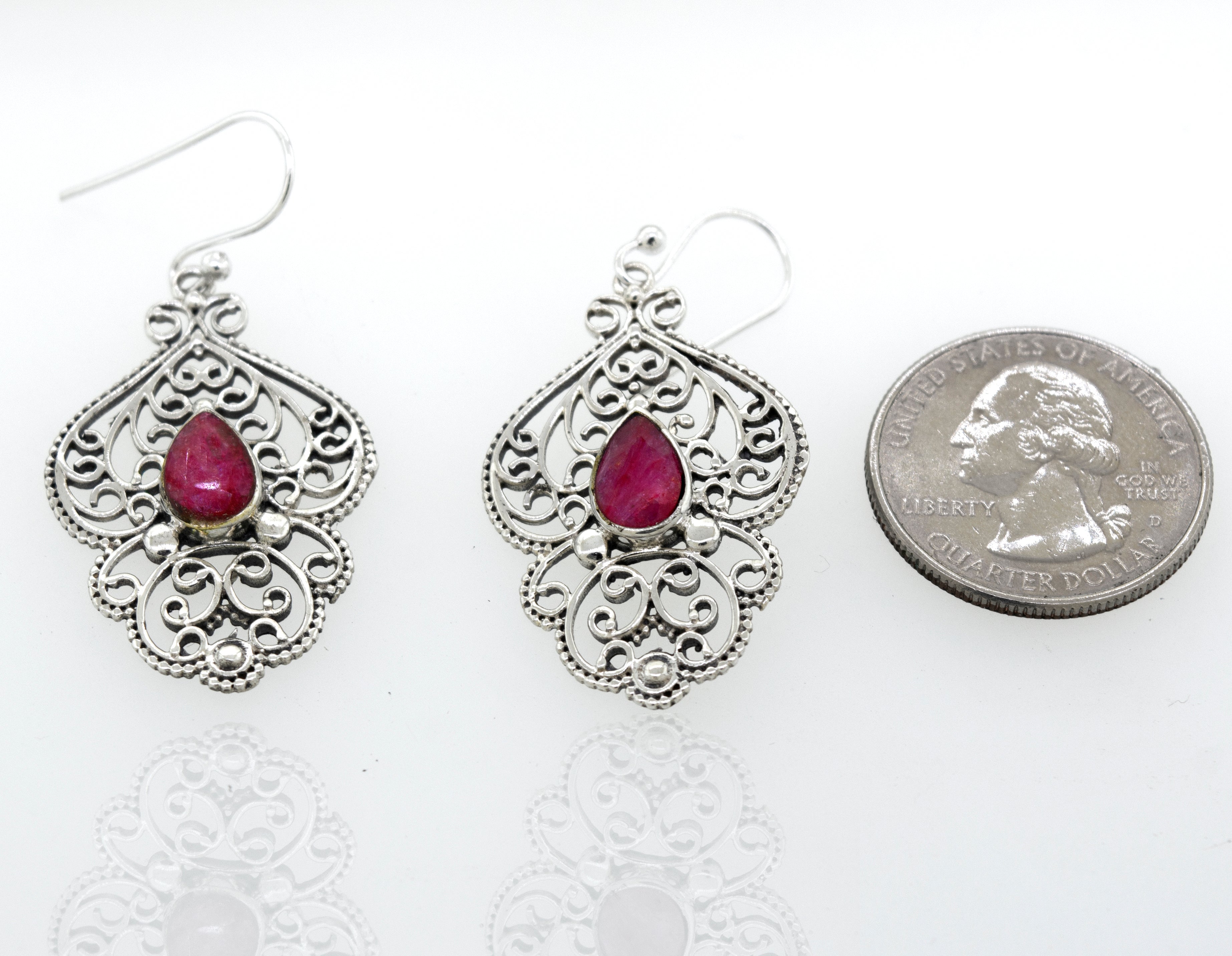 A pair of Super Silver Teardrop Ruby Earrings With Freestyle Silver Design.