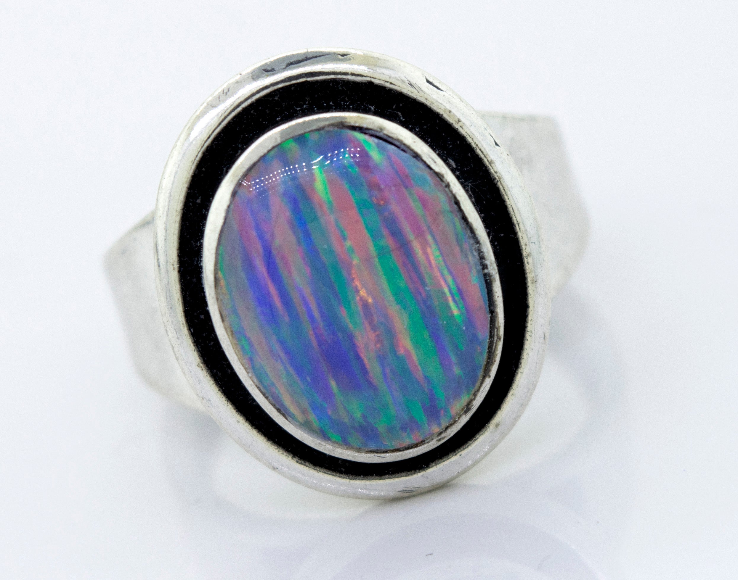 A minimalist silver ring with a Radiant Opal Signet stone.