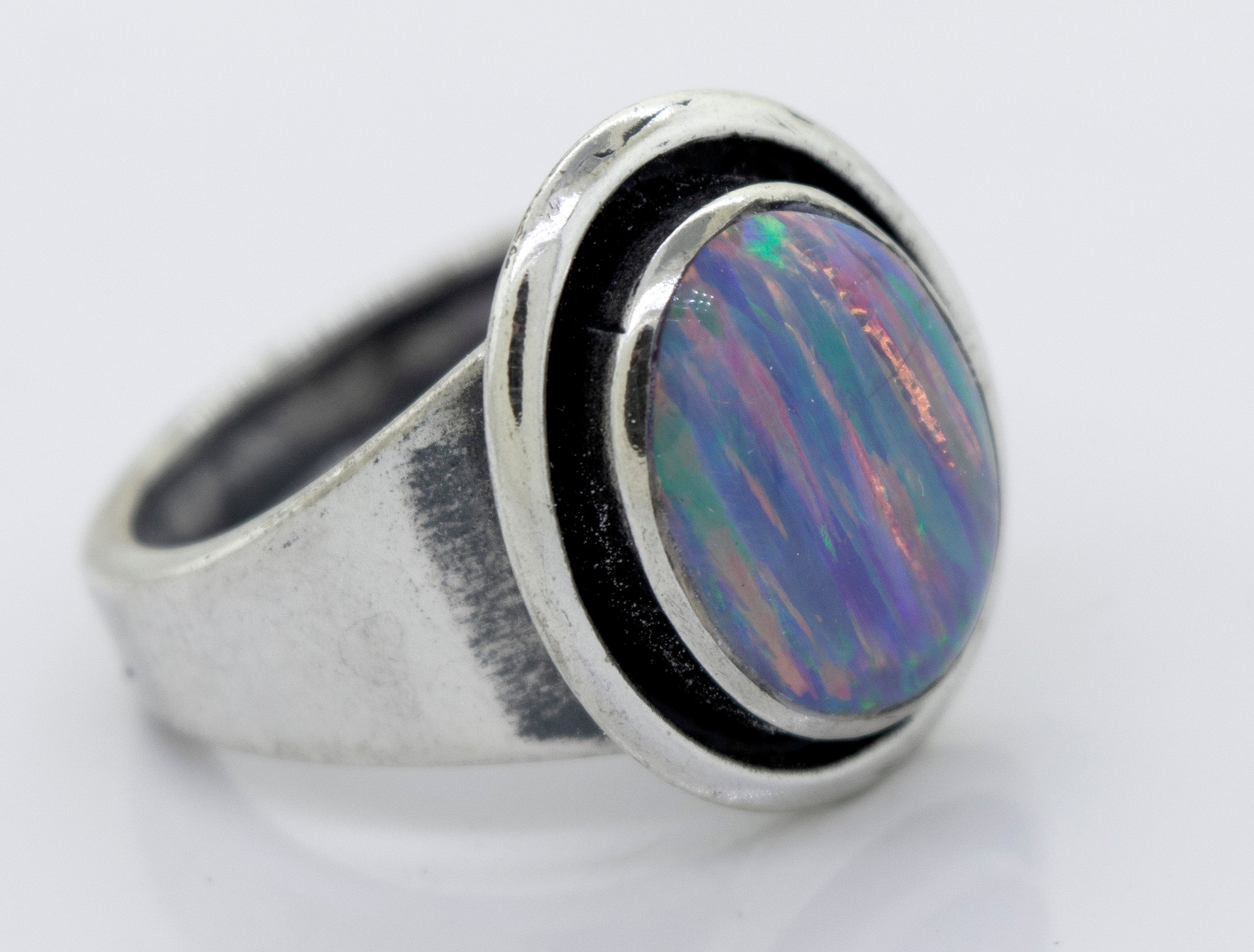 A Radiant Opal Signet Ring with an opal stone.