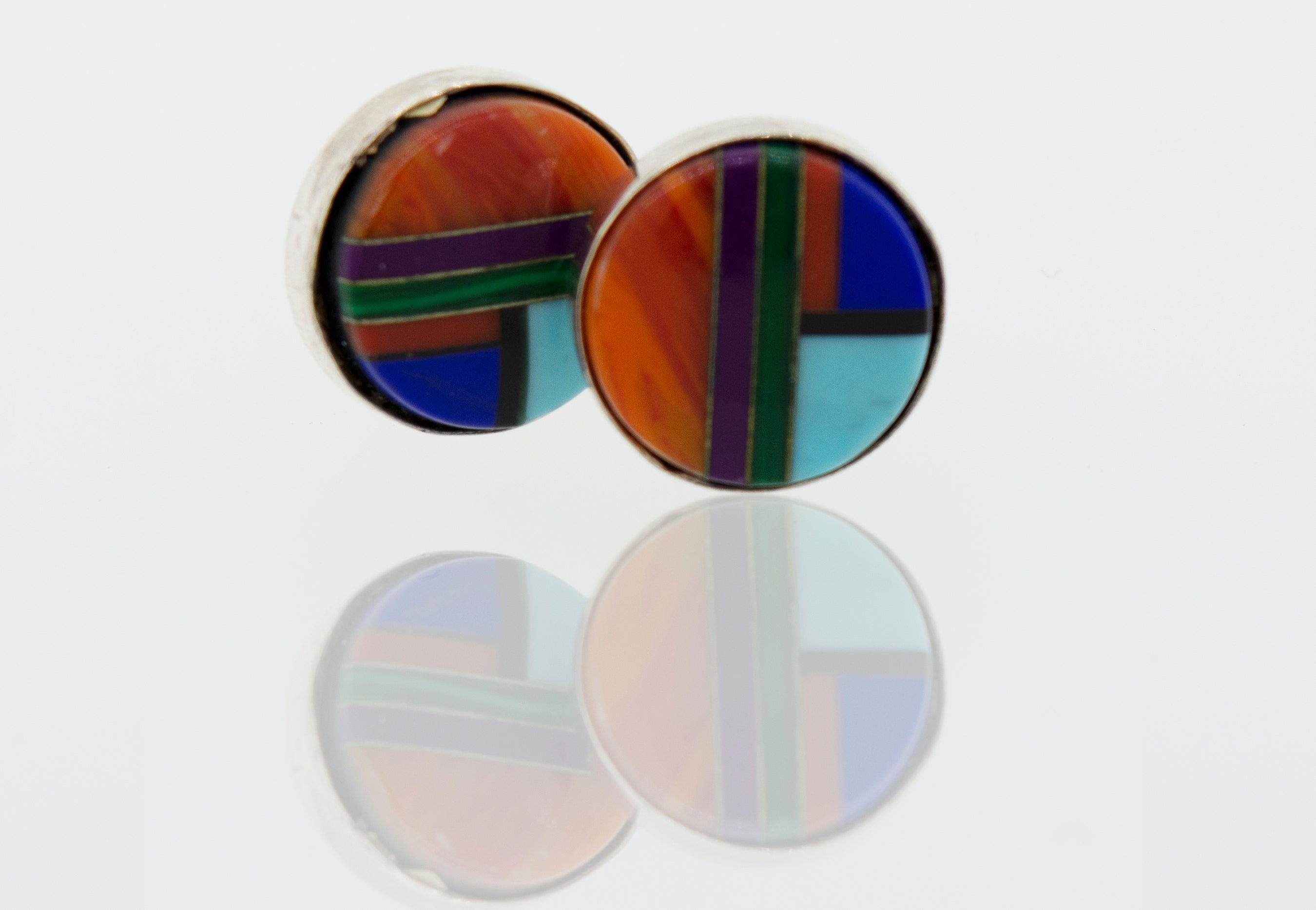 A pair of American Made Multi-Stone Round Stud Earrings, made by Super Silver, on a white surface.