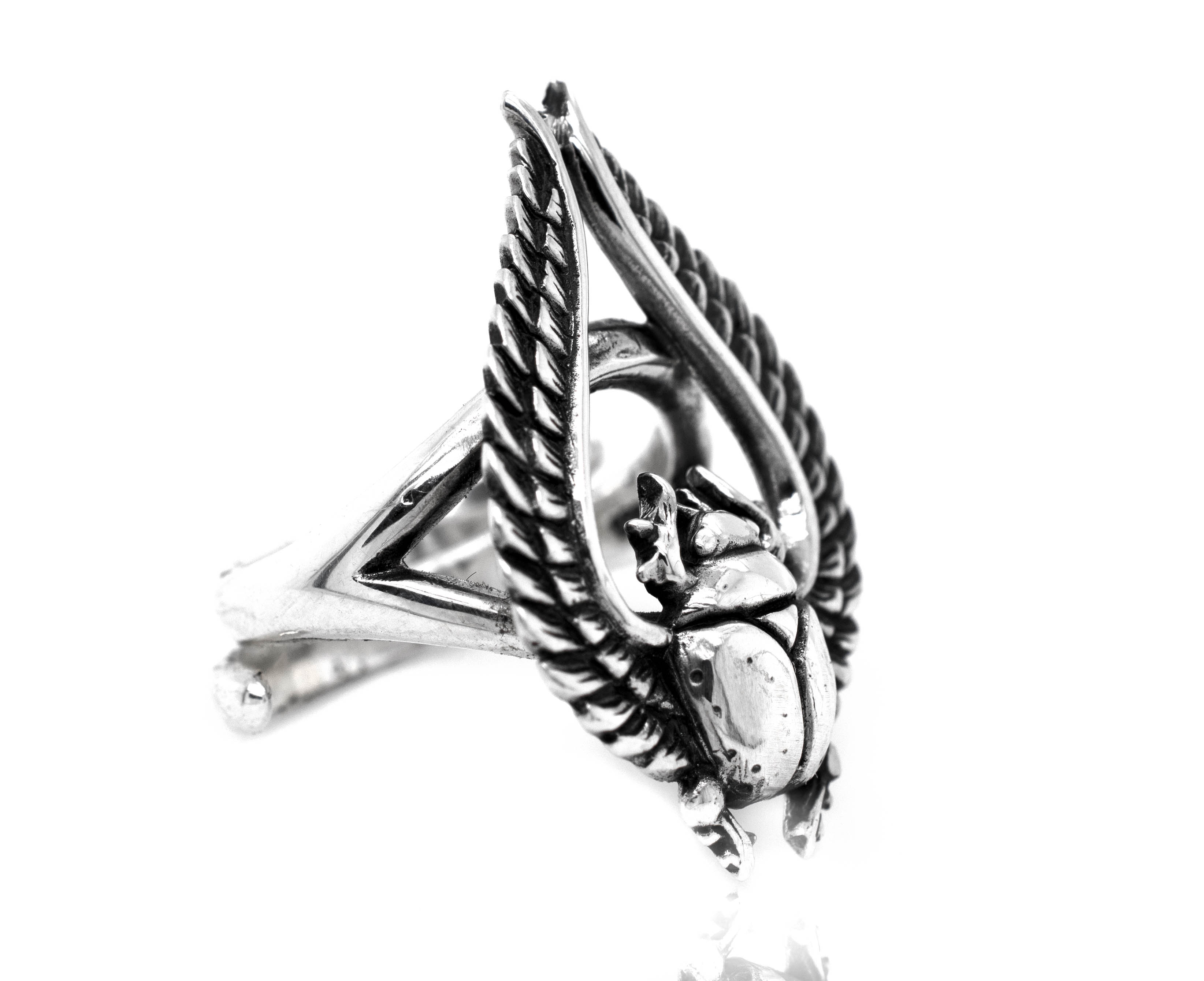 An artisan silver Winged Scarab Ring boasting a striking statement with an Egyptian scarab beetle.