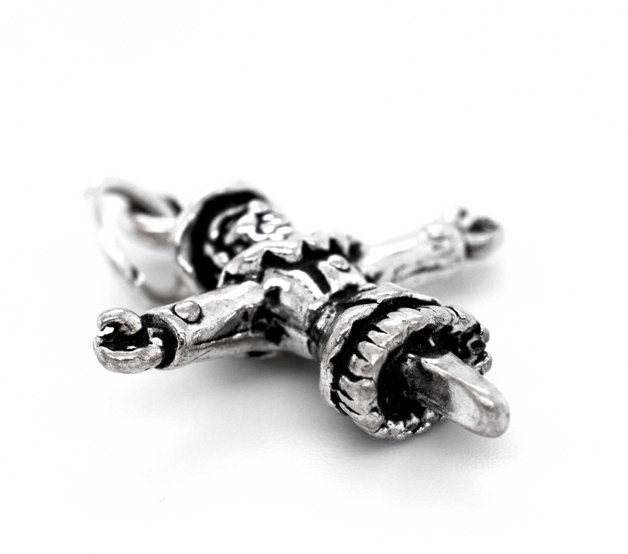 A Super Silver Spooky Scarecrow Charm with a cross on it.