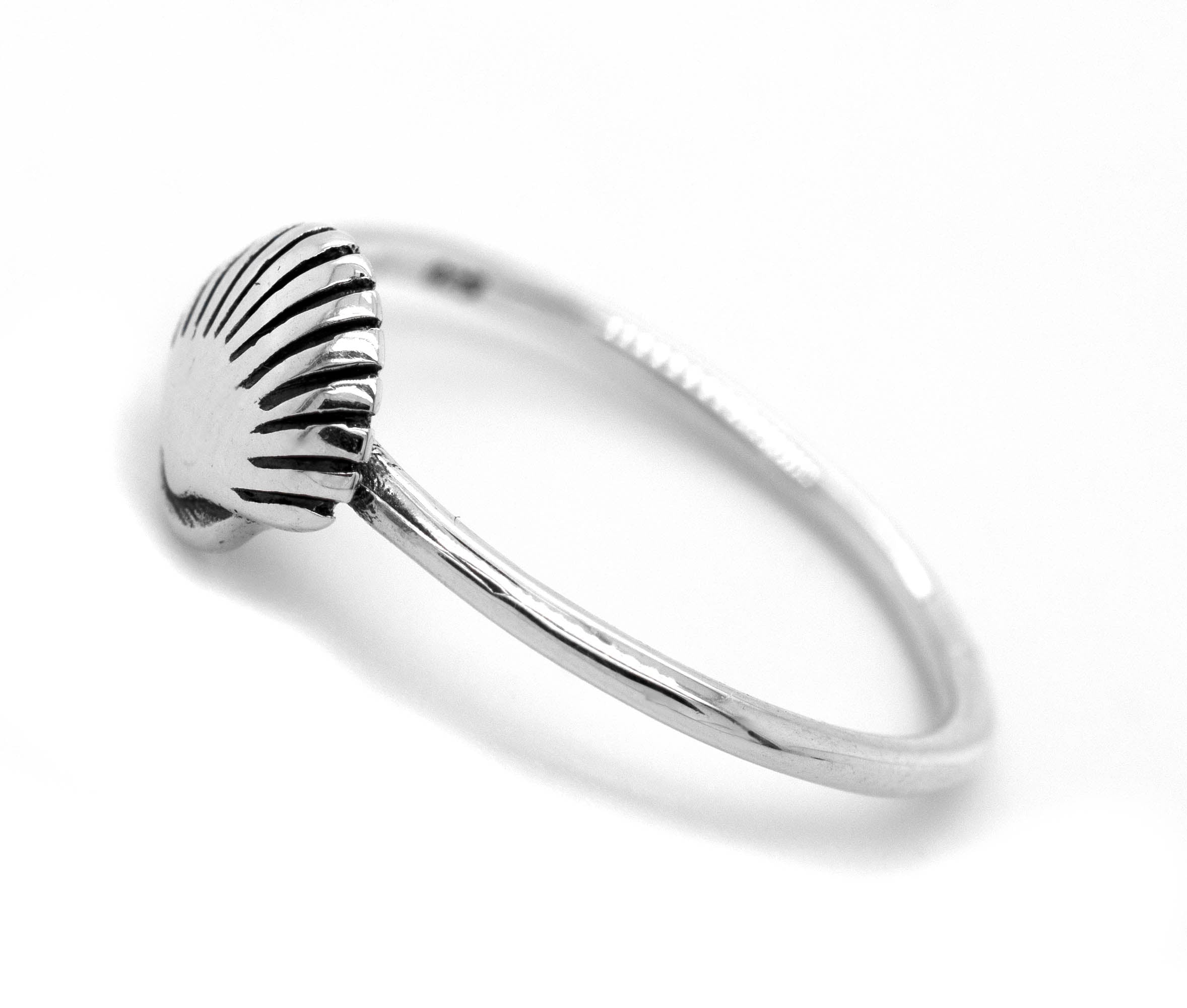 An ocean lover's dream come true - a Delicate Seashell Ring tastefully crafted in silver by Super Silver, perfect for storefront displays or personal adornment.