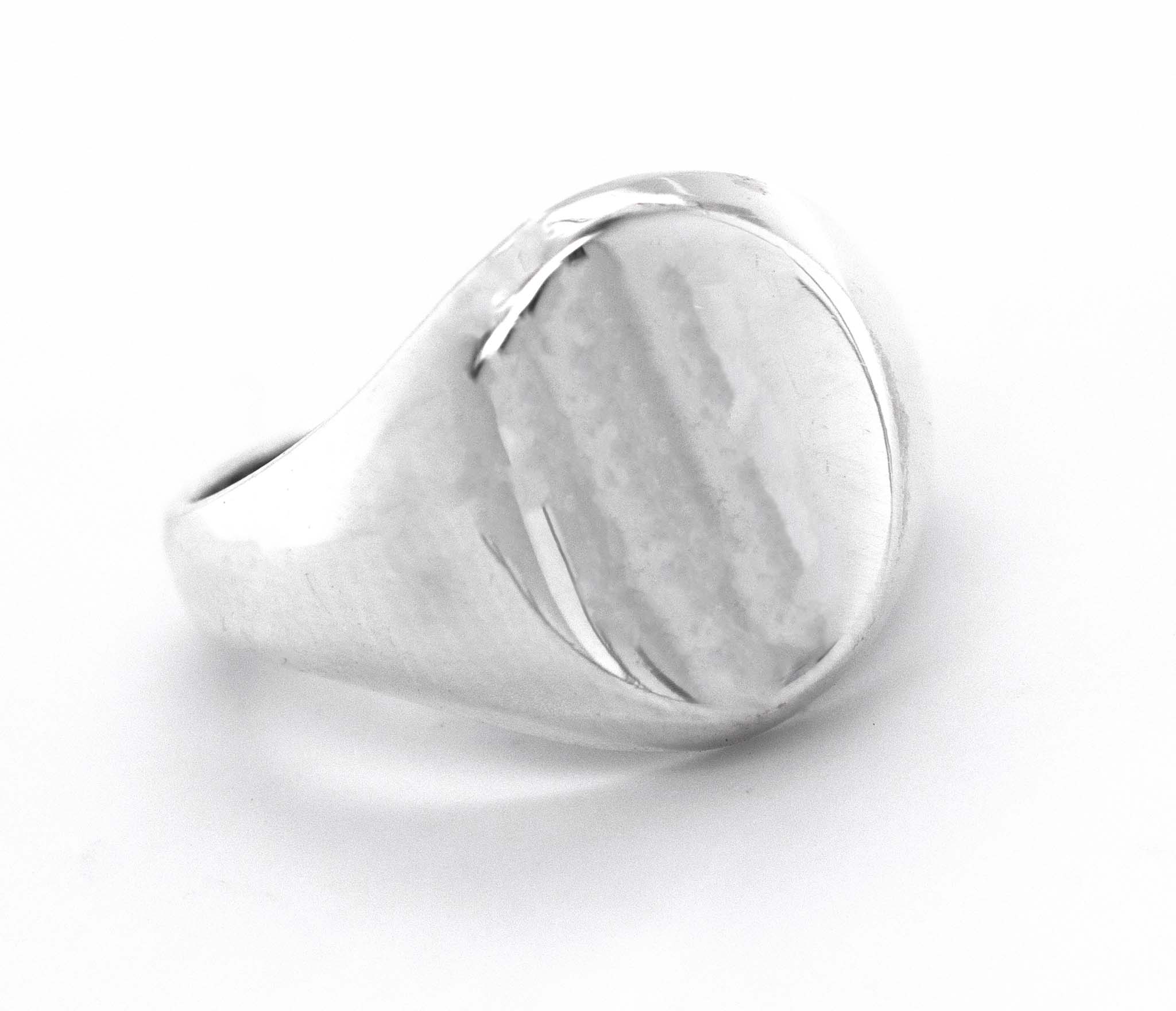 An everyday wear Super Silver Oval Signet Ring with an engraved design on a white background.