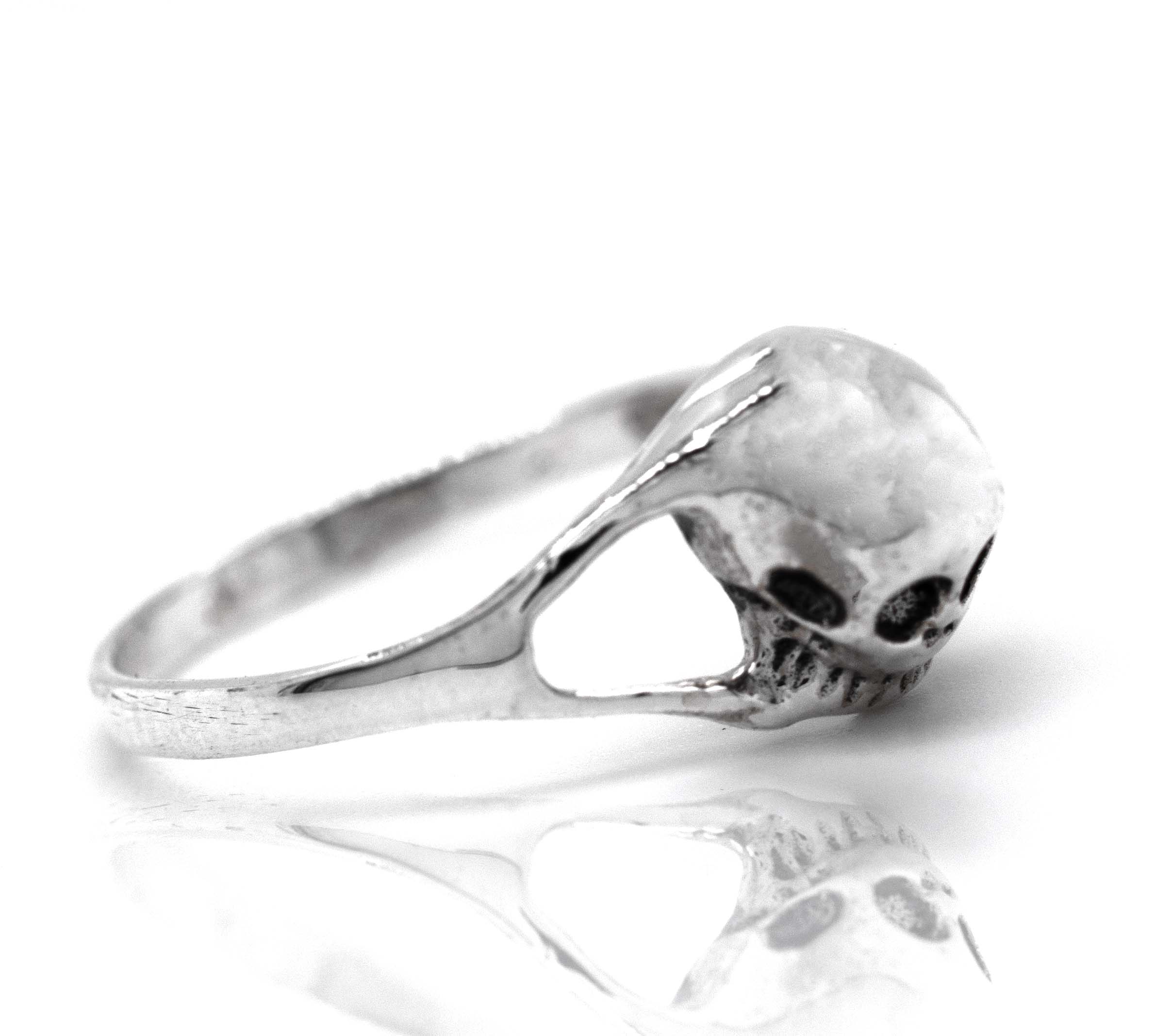 A mens Dainty Skull Ring with a skull on it.