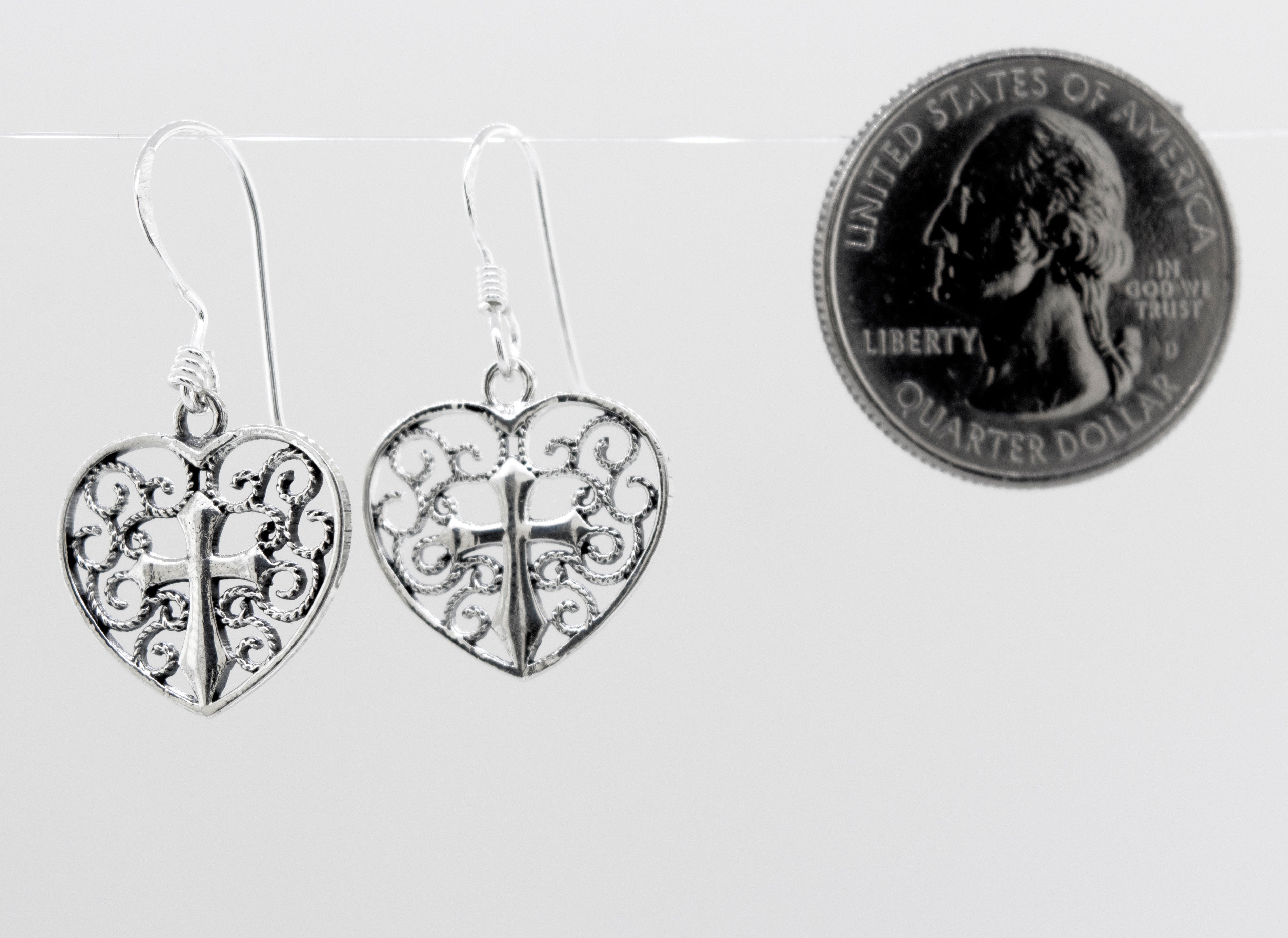 A pair of open Filigree Heart with Cross Earring, Super Silver sterling silver earrings.
