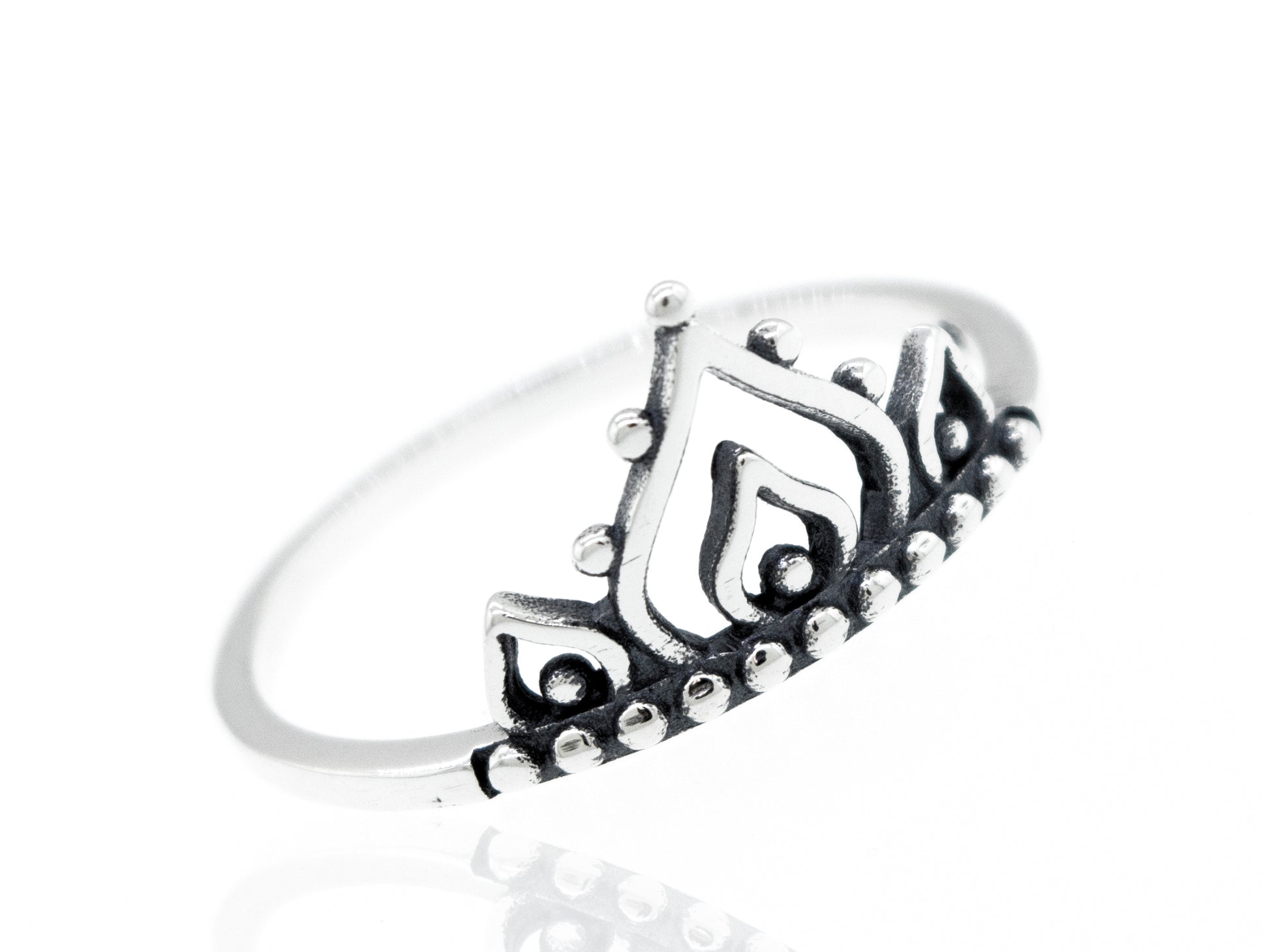 A Delicate Half Mandala Ring with a tiara on it.