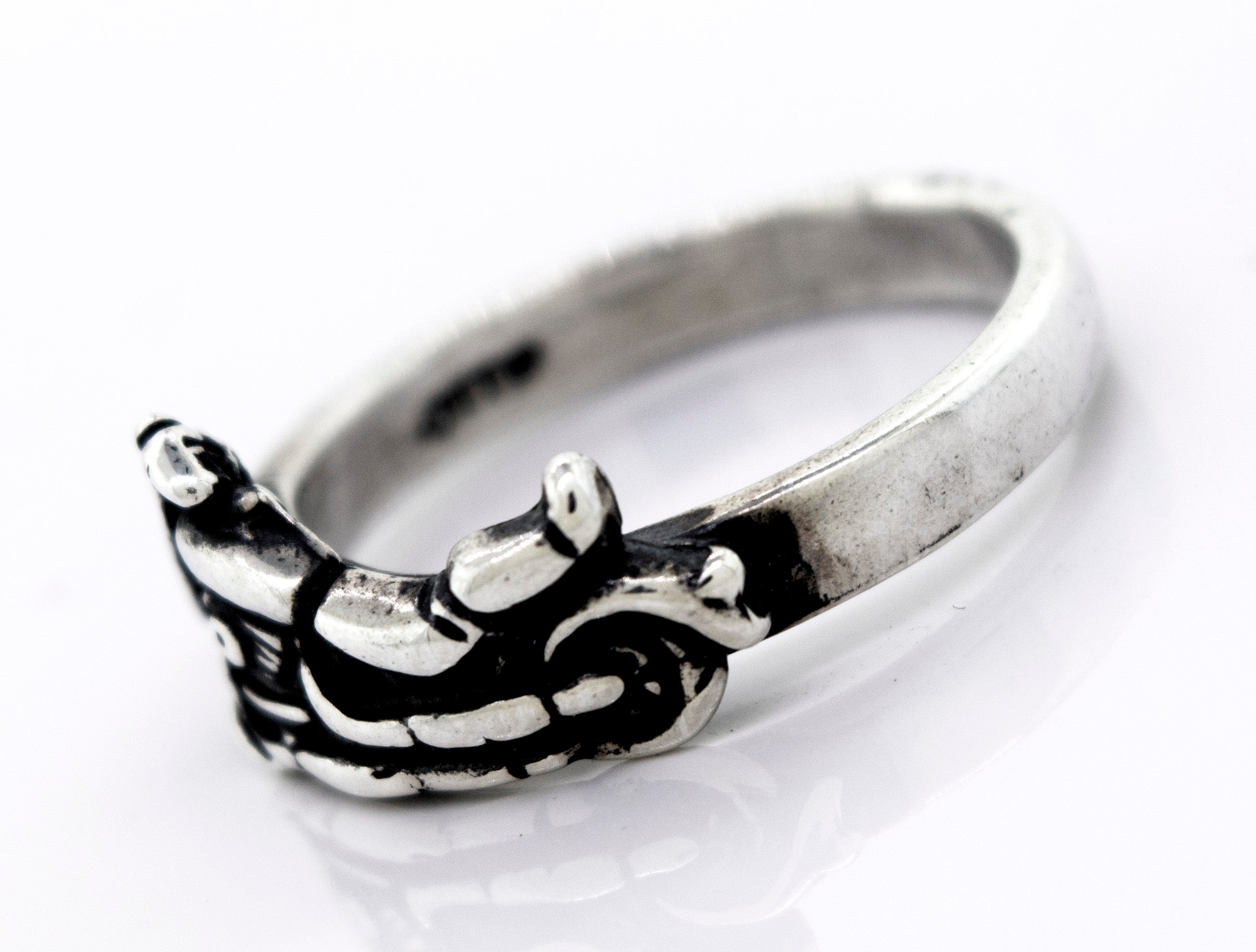 A handcrafted Super Silver American Made Motorcycle Ring with a skull and crossbones.