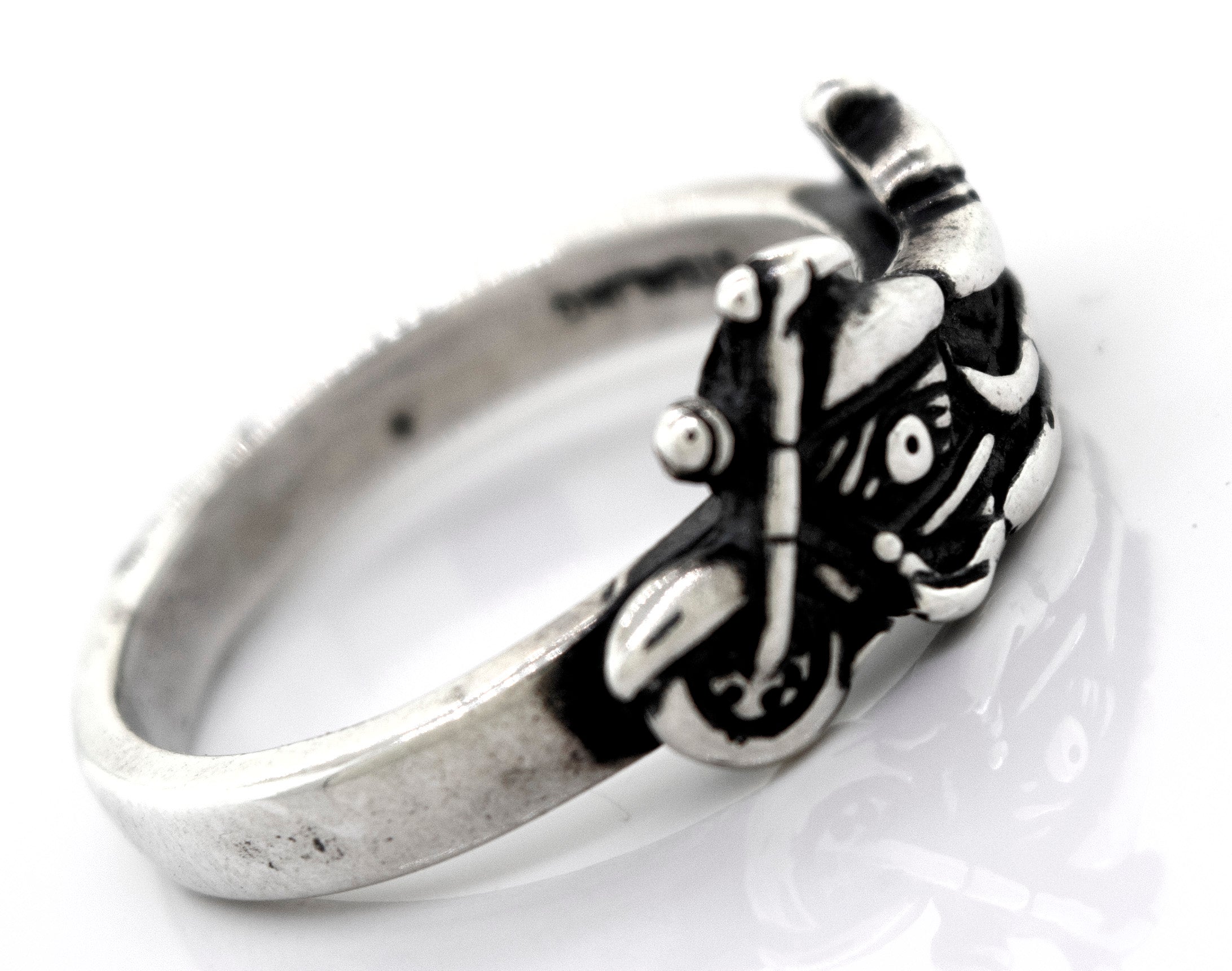 A handcrafted Super Silver American Made Motorcycle Ring featuring a skull and crossbones.