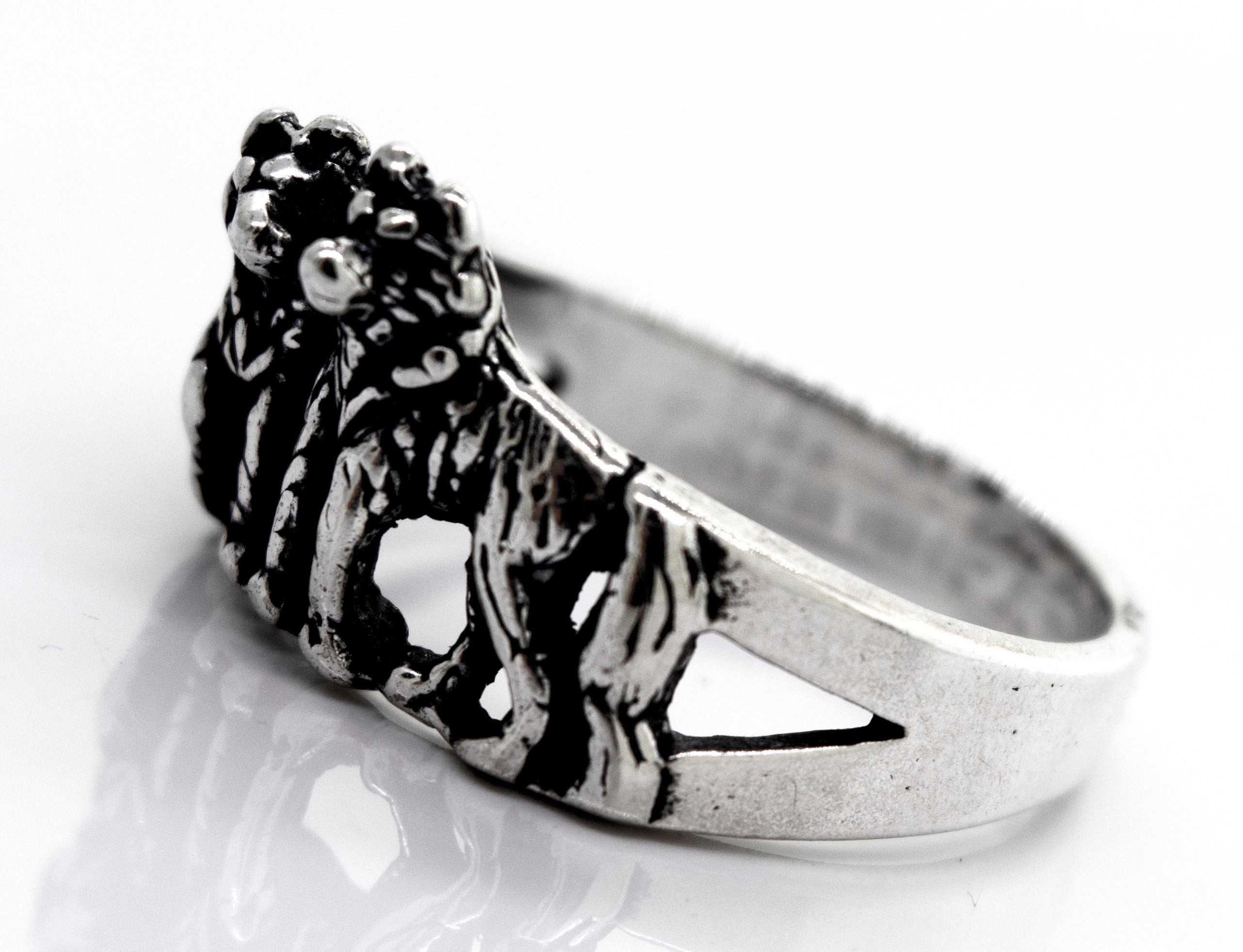 A handcrafted American Made Wolf Ring with two lions on it. (Brand Name: Super Silver)