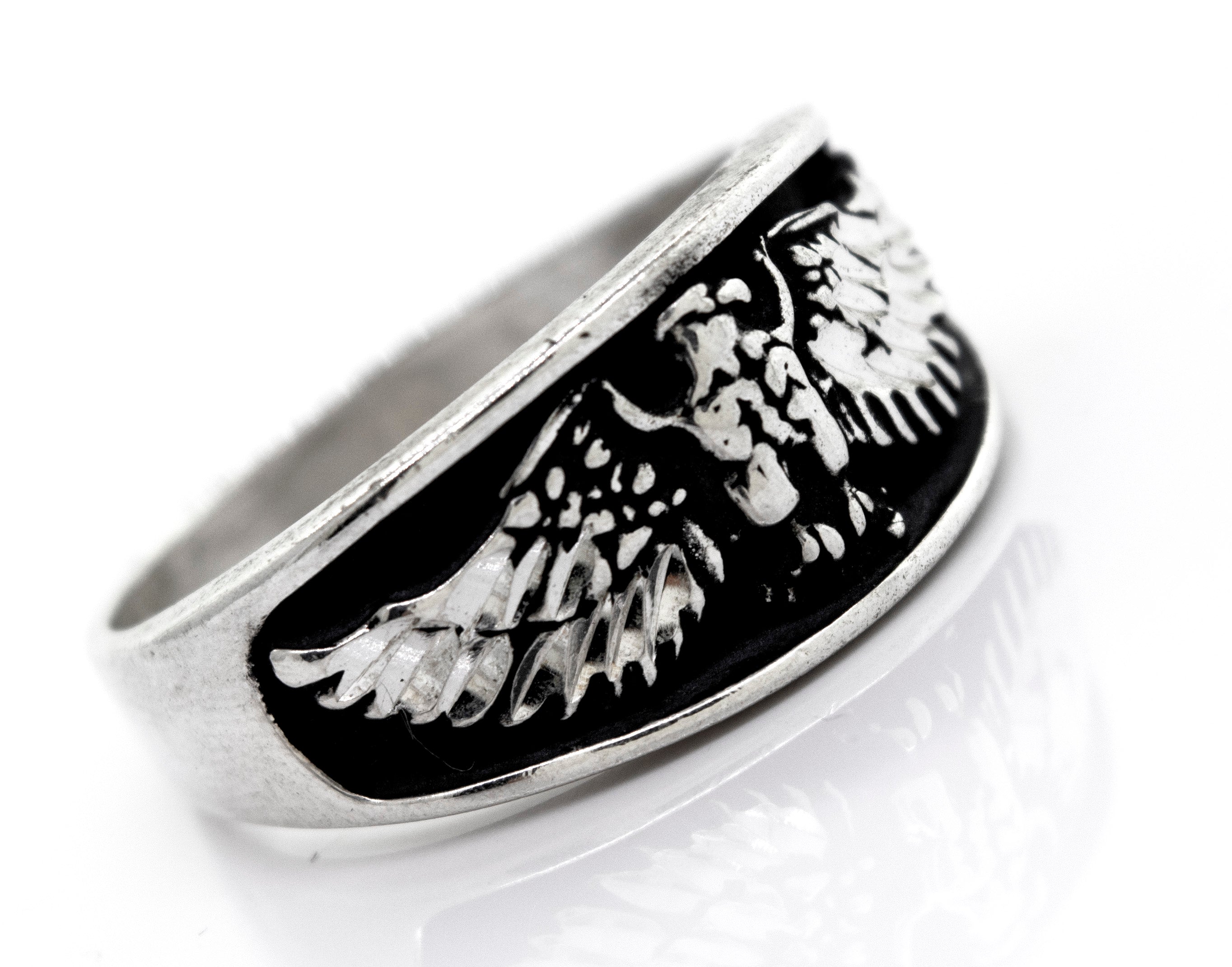 A handcrafted Super Silver American Made Heavy Eagle Ring with an eagle design.