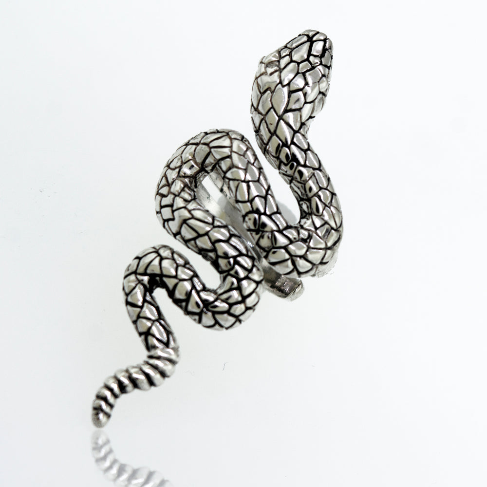 
                  
                    An adjustable Long Alluring Snake Ring crafted by an artisan, resting on a clean white surface.
                  
                