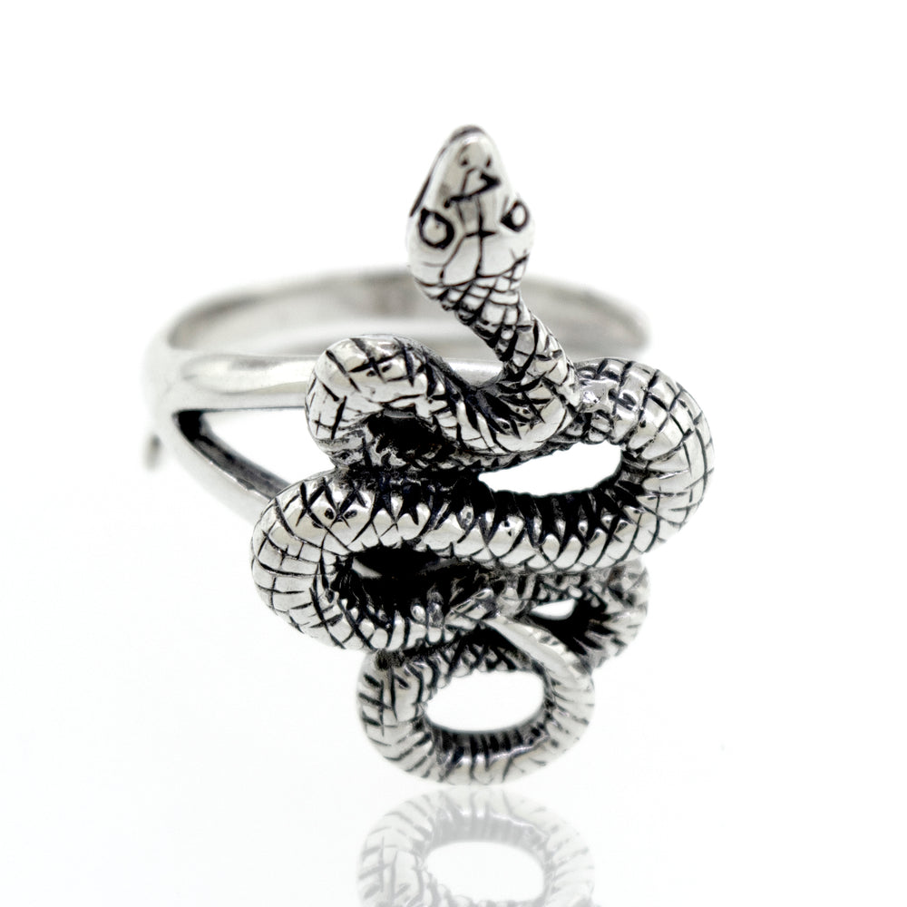 An artisan Compelling Snake Ring on a white background.