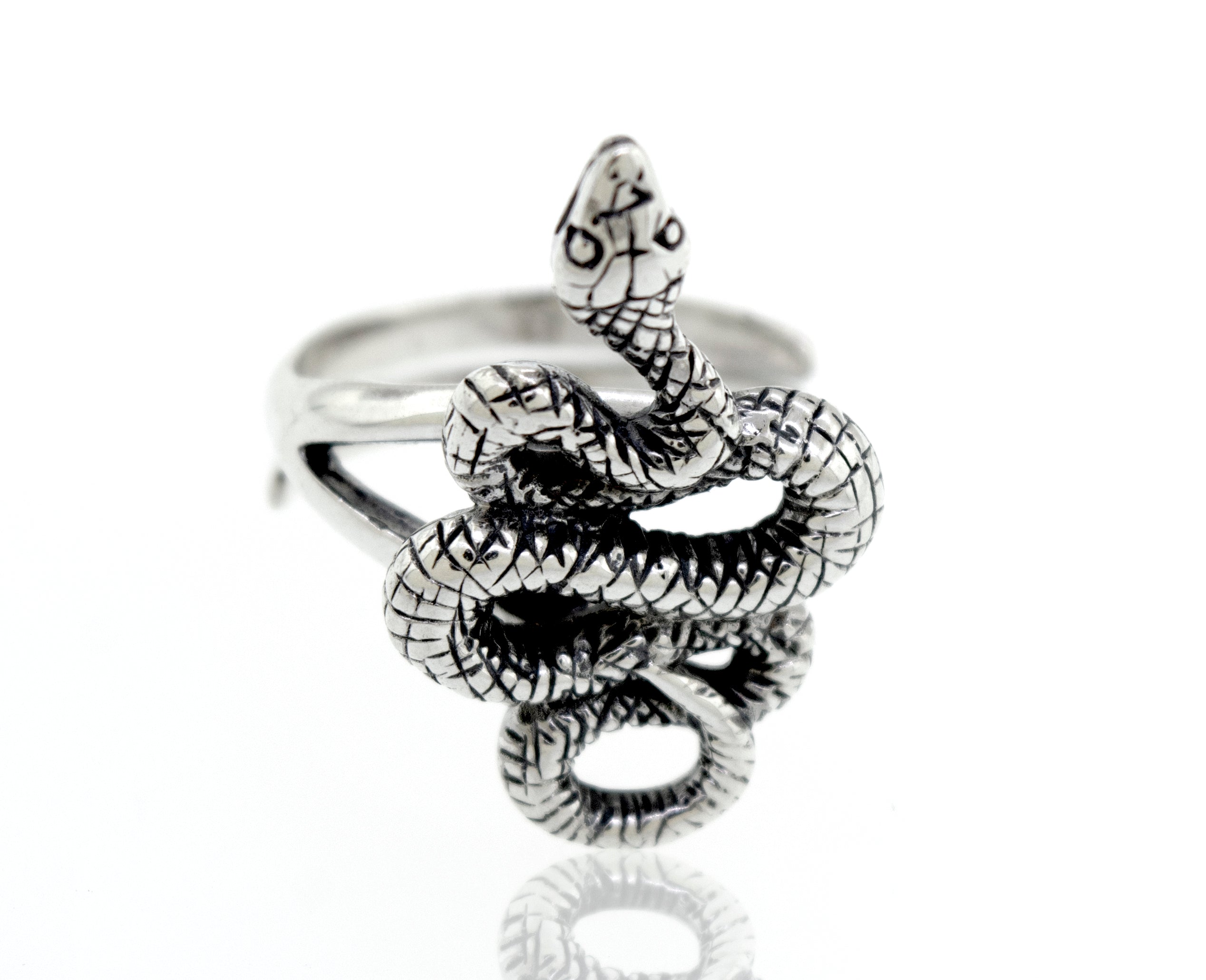An artisan Compelling Snake Ring on a white background.