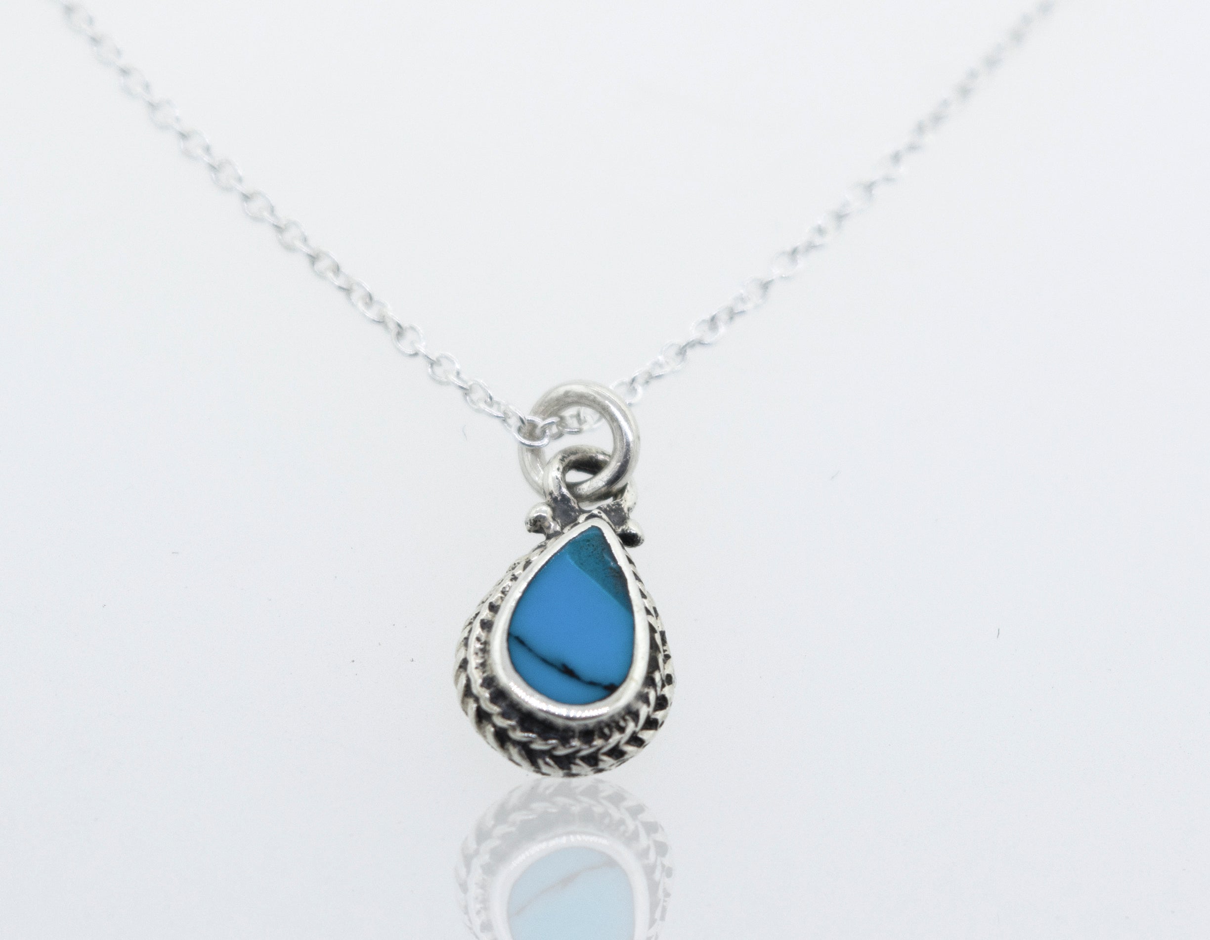 A Super Silver Blue Turquoise Teardrop Necklace with a 18" chain and a small teardrop pendant featuring a blue turquoise stone.
