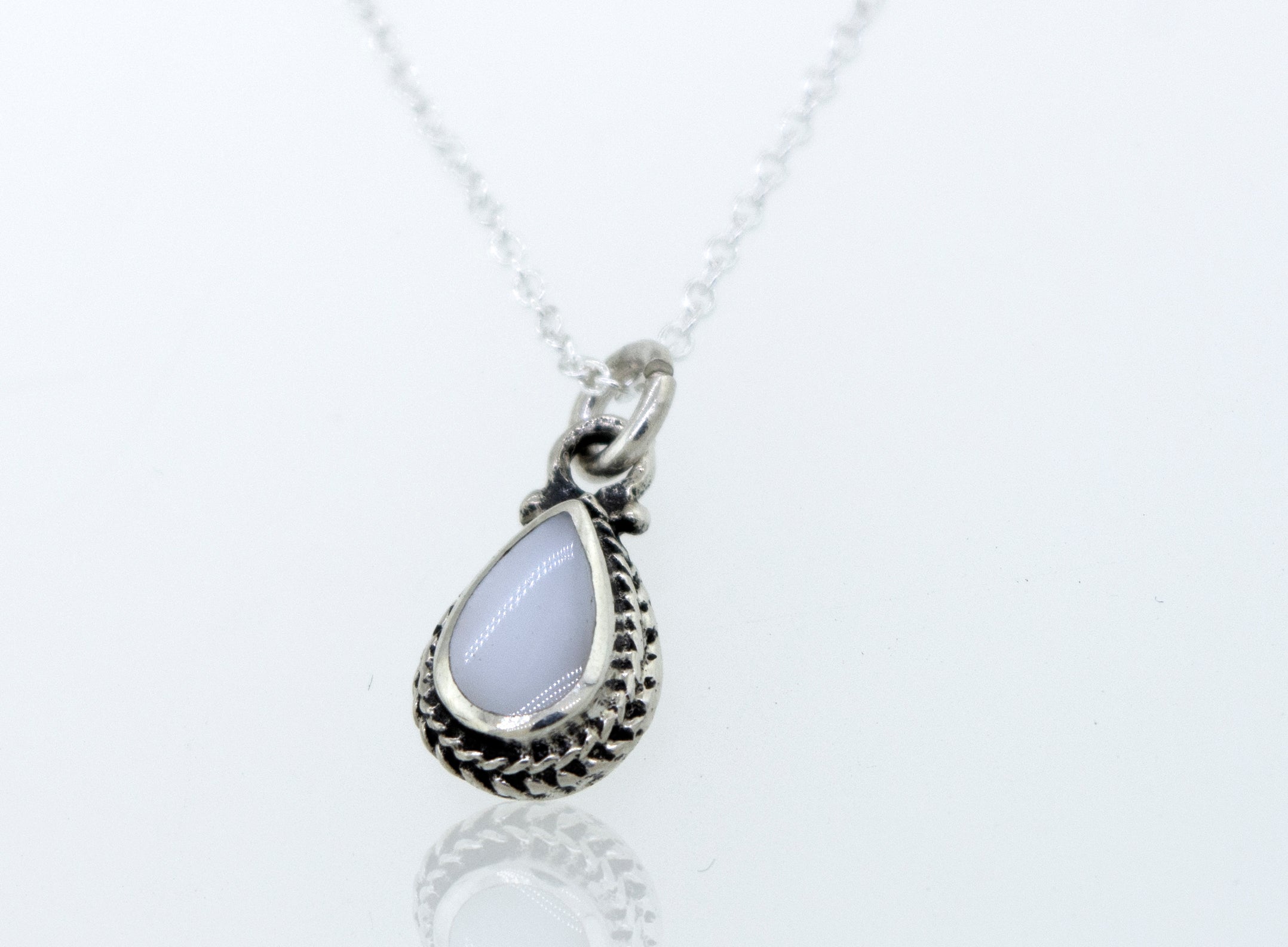 A Mother of Pearl Teardrop Necklace featuring a mother of pearl stone, elegantly crafted in sterling silver with a cable link chain by Super Silver.