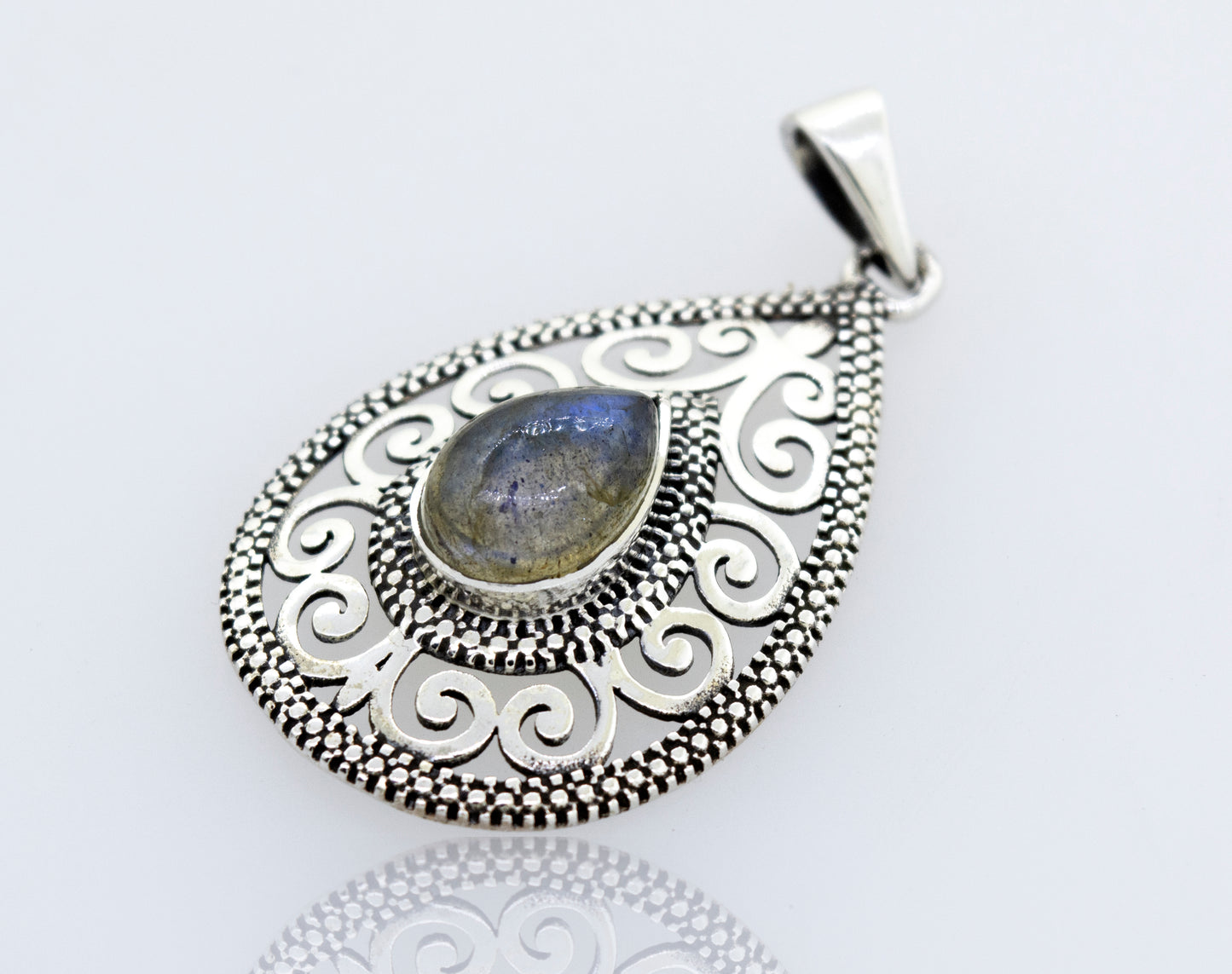 A filigree Super Silver Labradorite Teardrop Pendant featuring a beautiful Labradorite stone.