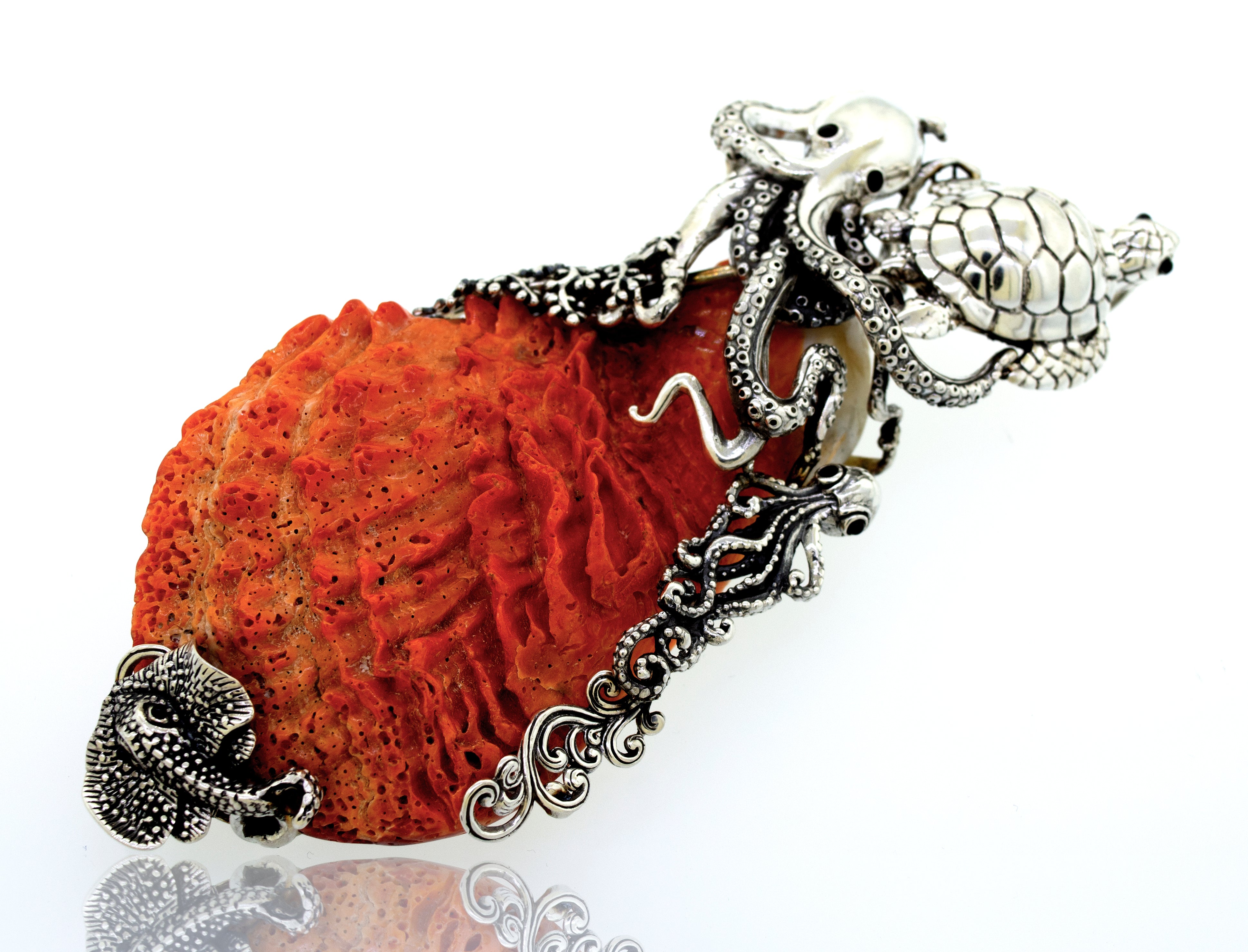A Super Silver Handcrafted Spiny Shell Designer Pendant shaped like an octopus adorned with spiny oyster shell.