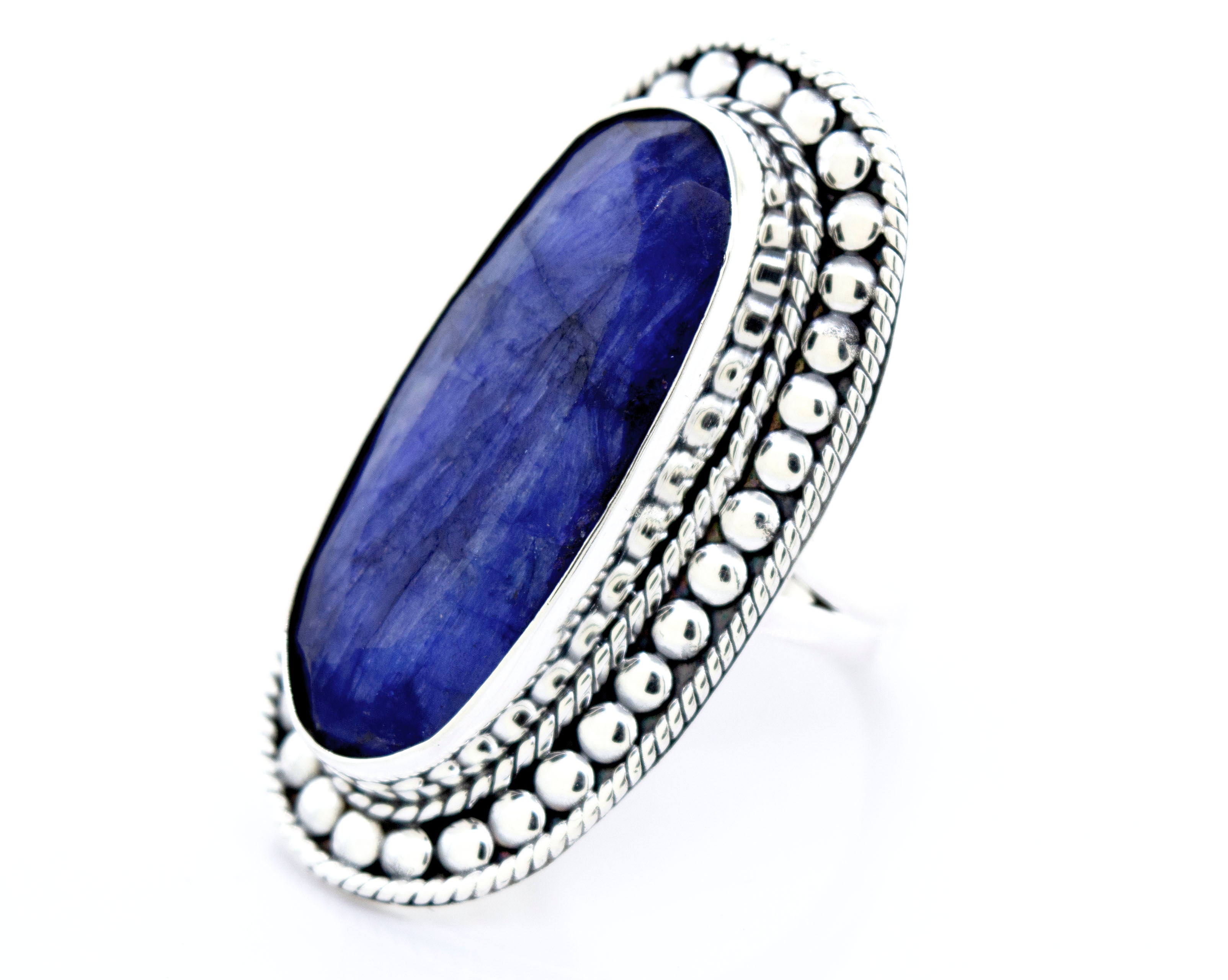 An Elegant Raw Blue Sapphire Ring by Super Silver, with a lapis stone.
