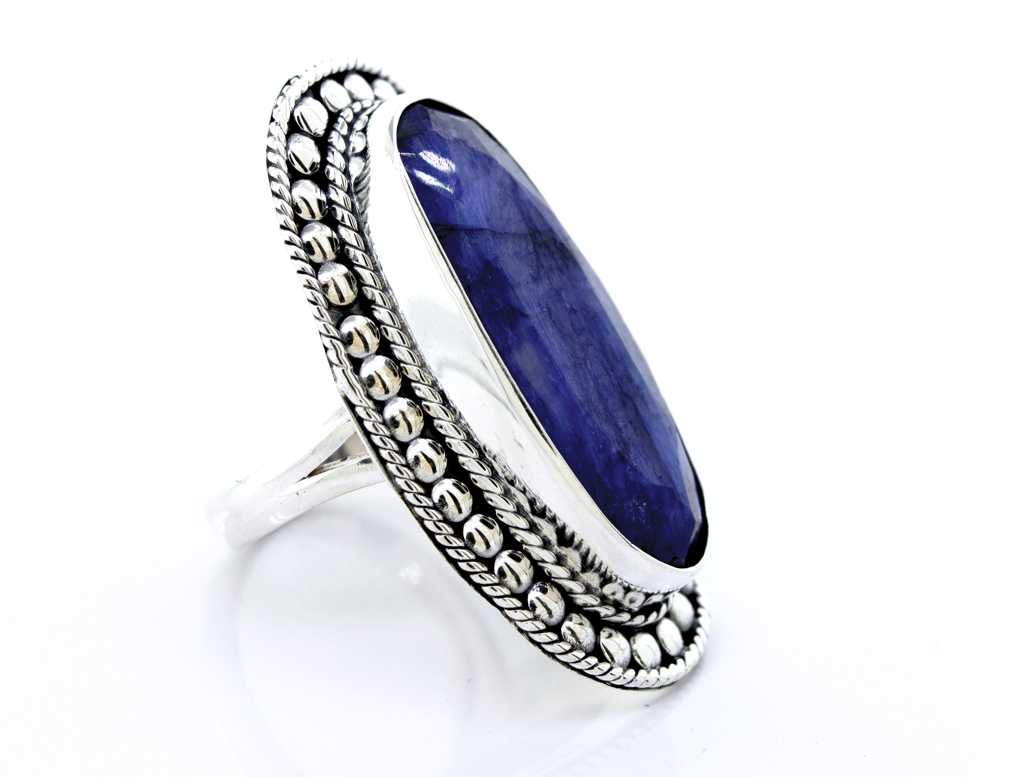 An Elegant Raw Blue Sapphire Ring with a lapis stone in a silver setting, made by Super Silver.
