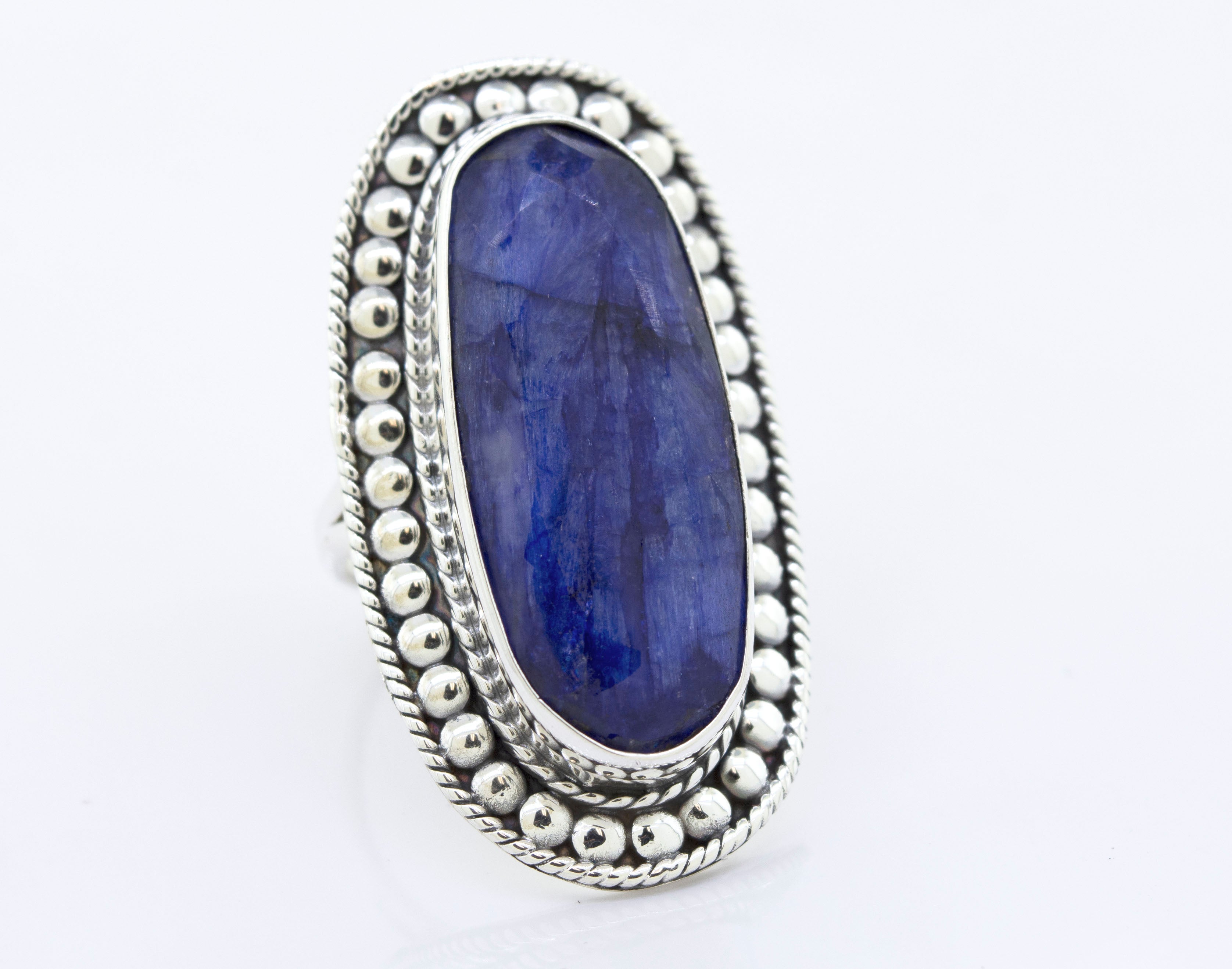 An Elegant Raw Blue Sapphire Ring with a sturdy blue sapphire stone by Super Silver.