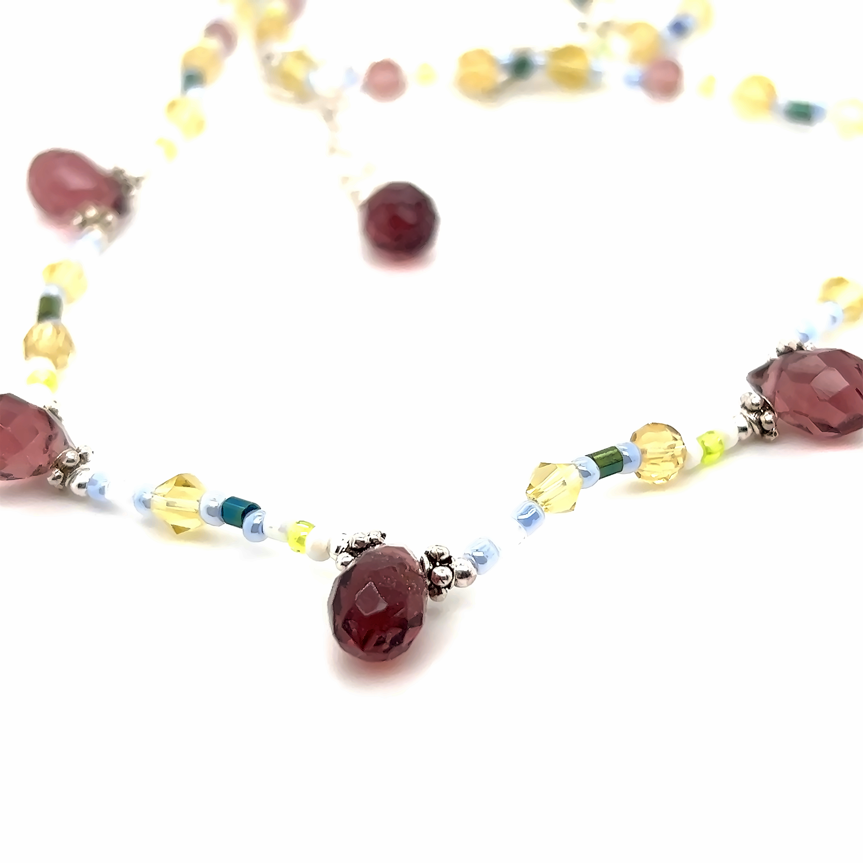 A Super Silver Beaded Multicolor Necklace with red, yellow and green beads.