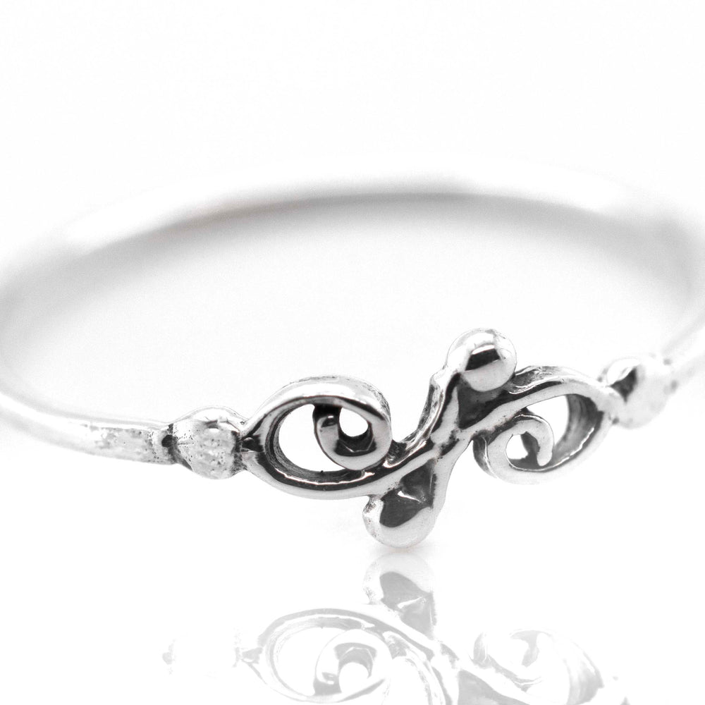A Dainty Filigree Ring from Super Silver with a swirl filigree design perfect for day-to-day wear and stacking.