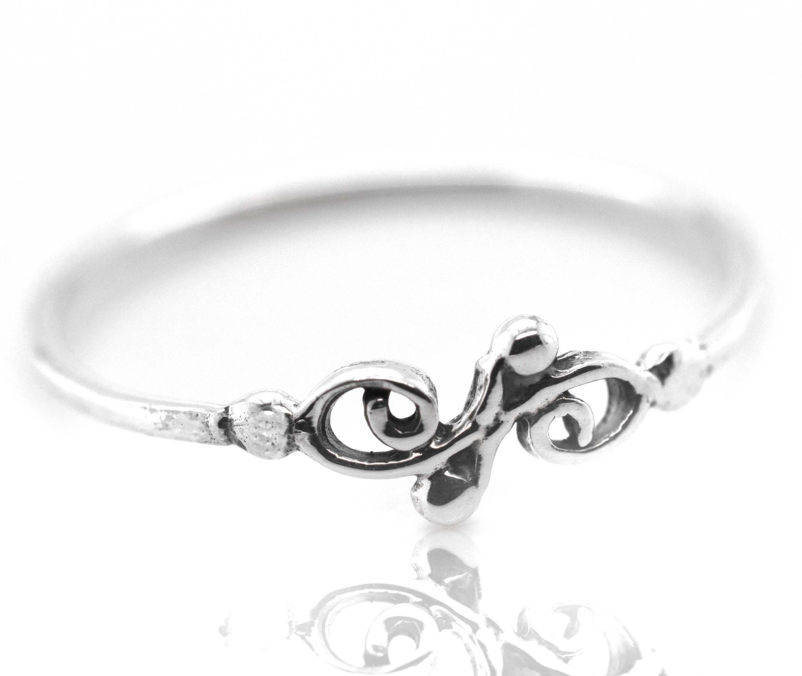 A Dainty Filigree Ring from Super Silver with a swirl filigree design perfect for day-to-day wear and stacking.