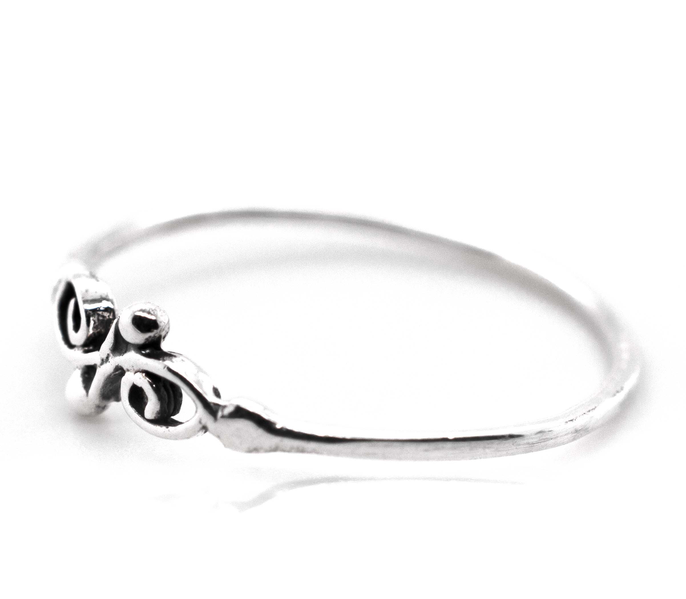 A Super Silver Dainty Filigree Ring with an ornate swirl filigree design, perfect for day-to-day wear or stacking.