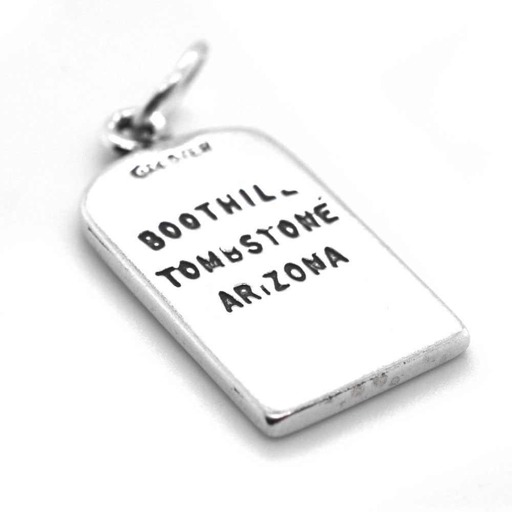 A Lester Moore Gravestone Charm pendant, inscribed with the words "Boot Hill Tontoe Arizona," by Super Silver.