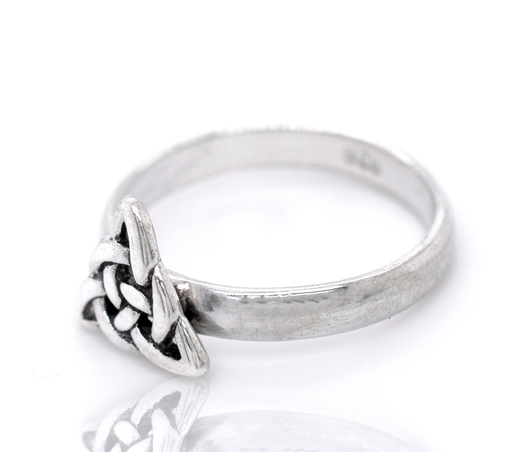 A sterling silver ring with a Dainty Celtic Triangle Ring design.