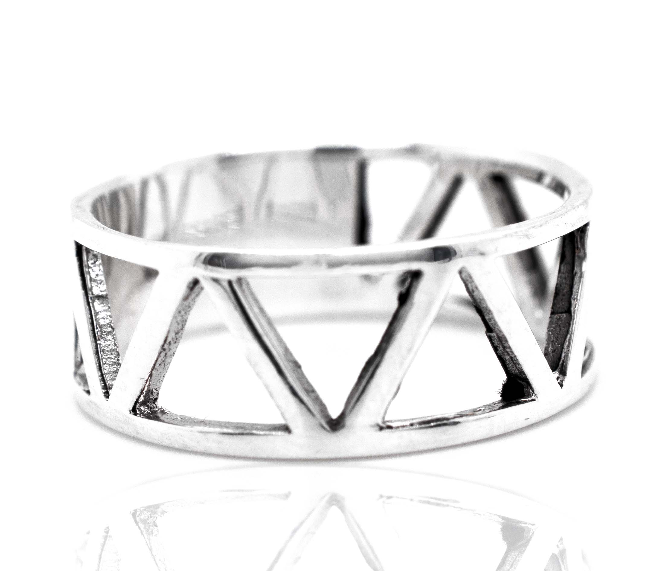 An everyday wear Super Silver ring with cutout triangles on a Wide Band With Cutout Triangle Design.