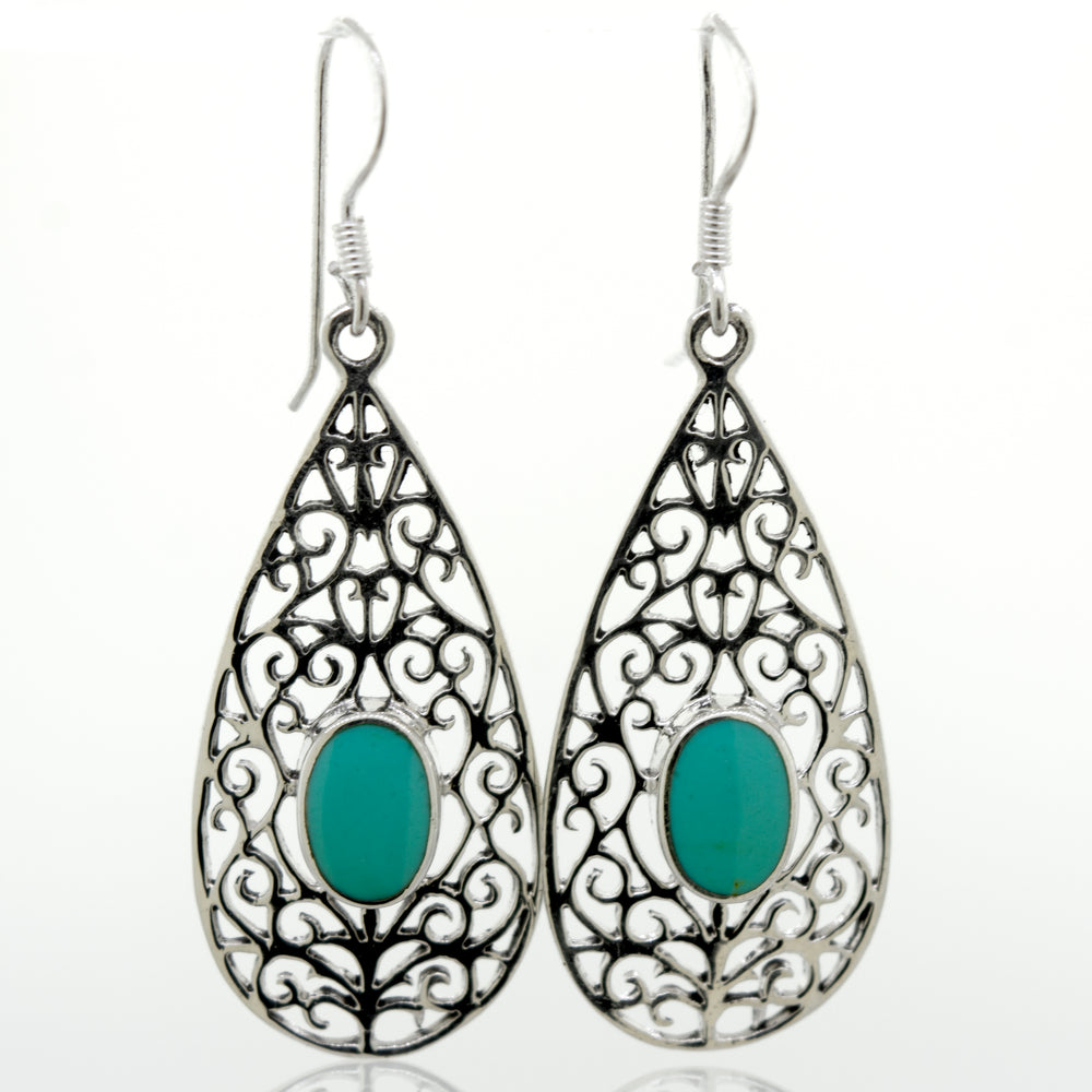 
                  
                    A pair of Elegant Teardrop Shape Turquoise Earrings with a filigree design, made from sterling silver, by Super Silver.
                  
                