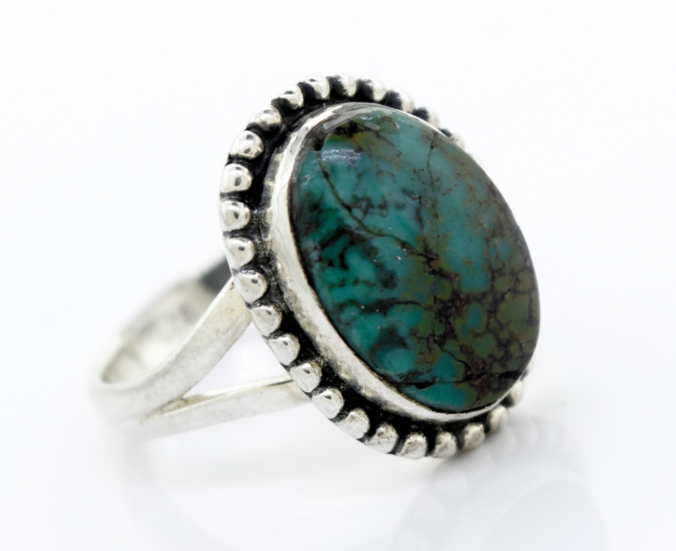 A Super Silver Oval Natural Turquoise Ring With Ball Border.