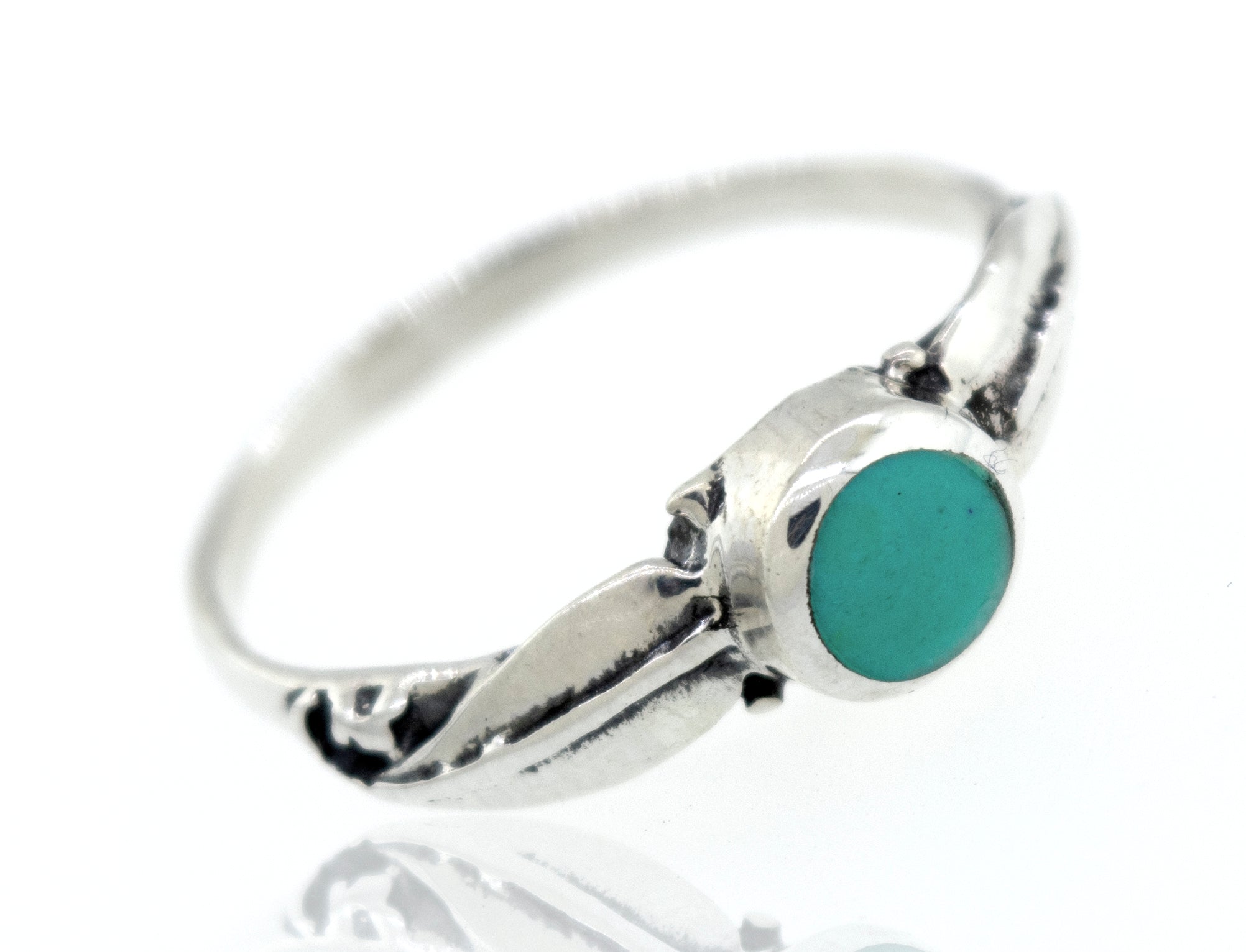 A sterling silver round stone ring with leaves.