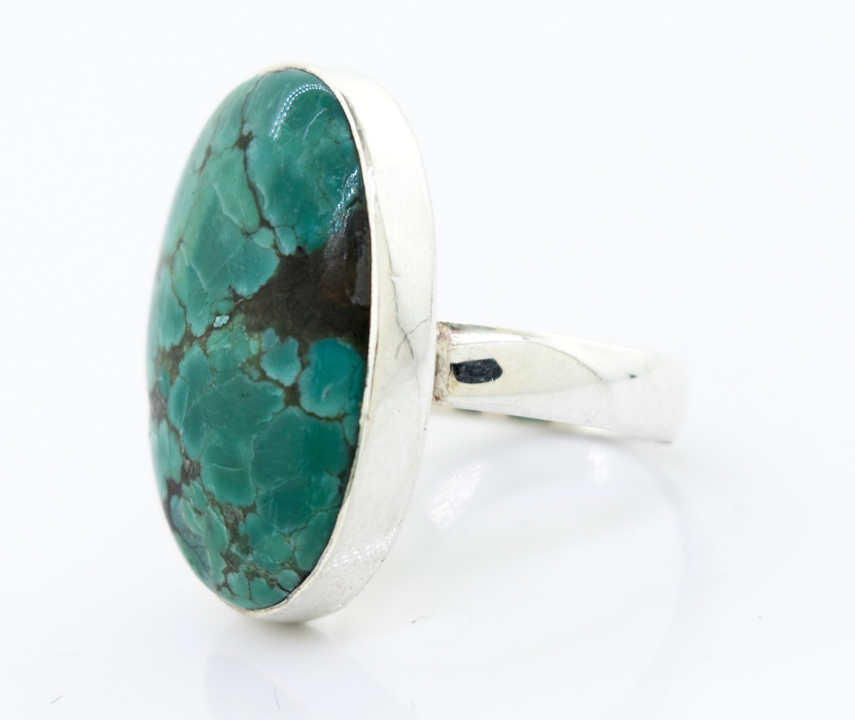 A Super Silver Oval Natural Turquoise Ring with a unique vibrance and a natural turquoise stone in the setting.