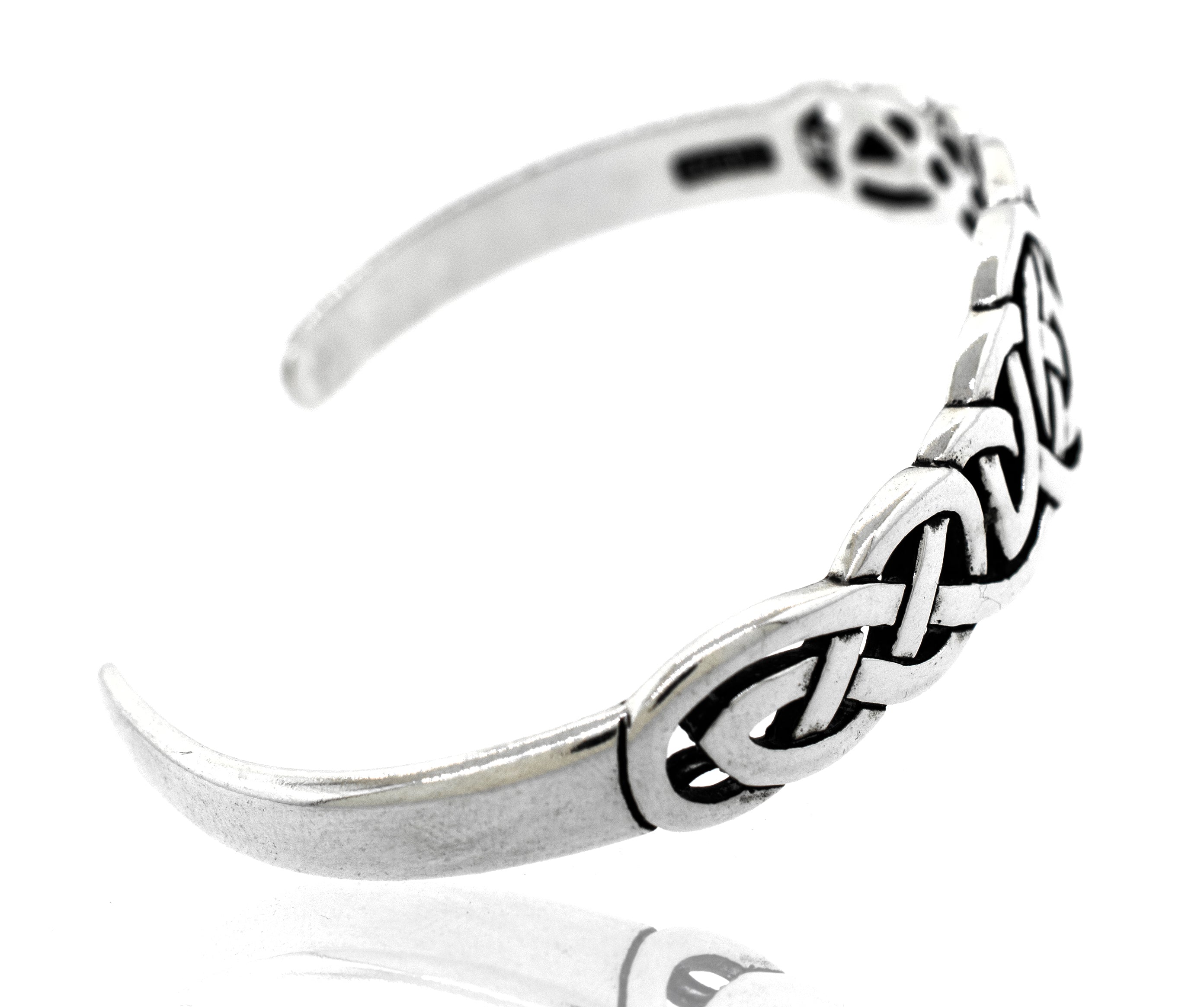 A Super Silver Celtic Knot Cuff bracelet, symbolizing an unbreakable bond.