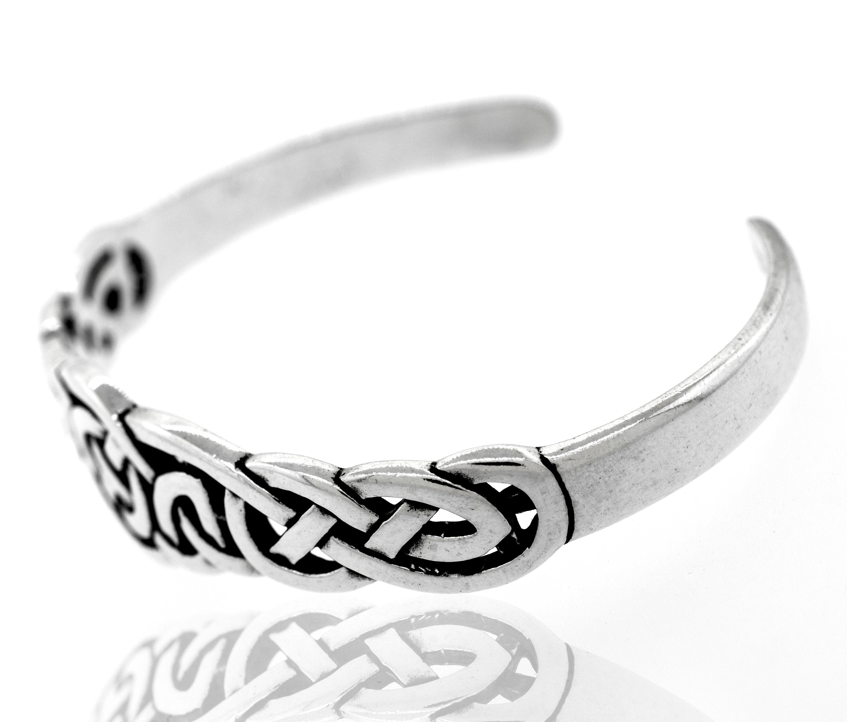 A Super Silver Celtic Knot Cuff bracelet with an unbreakable bond.