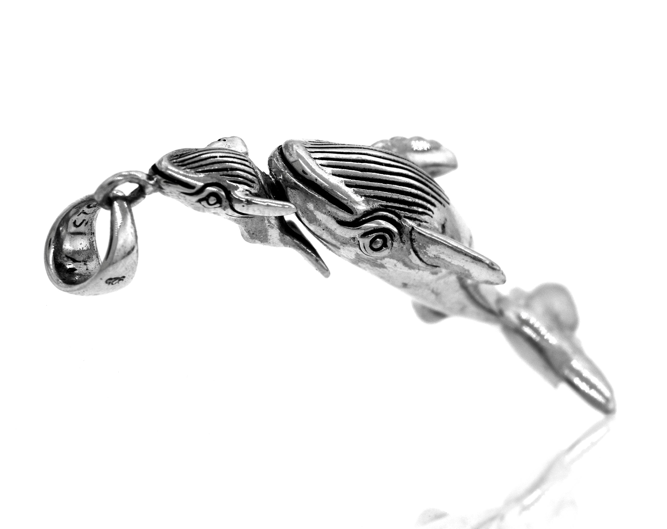 A Super Silver Handcrafted Whale And Calf Pendant, perfect for ocean lovers.