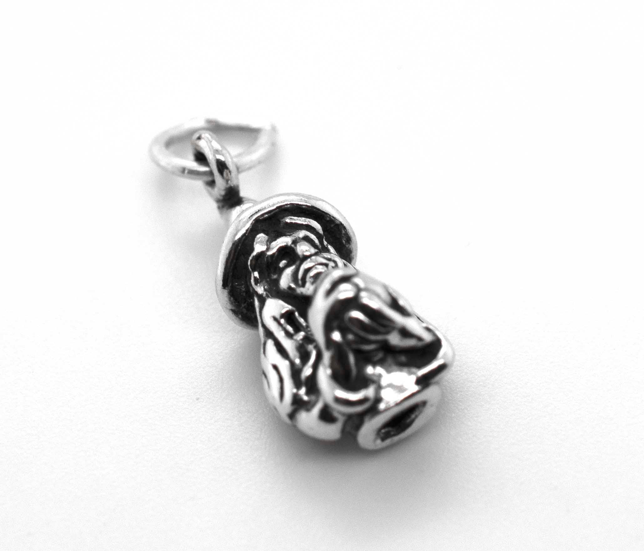 A Witch with Crystal Ball Charm bracelet from Super Silver with a man in a hat.
