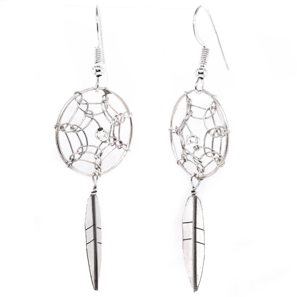 
                  
                    A pair of authentic Super Silver Zuni dreamcatcher earrings on a white background.
                  
                
