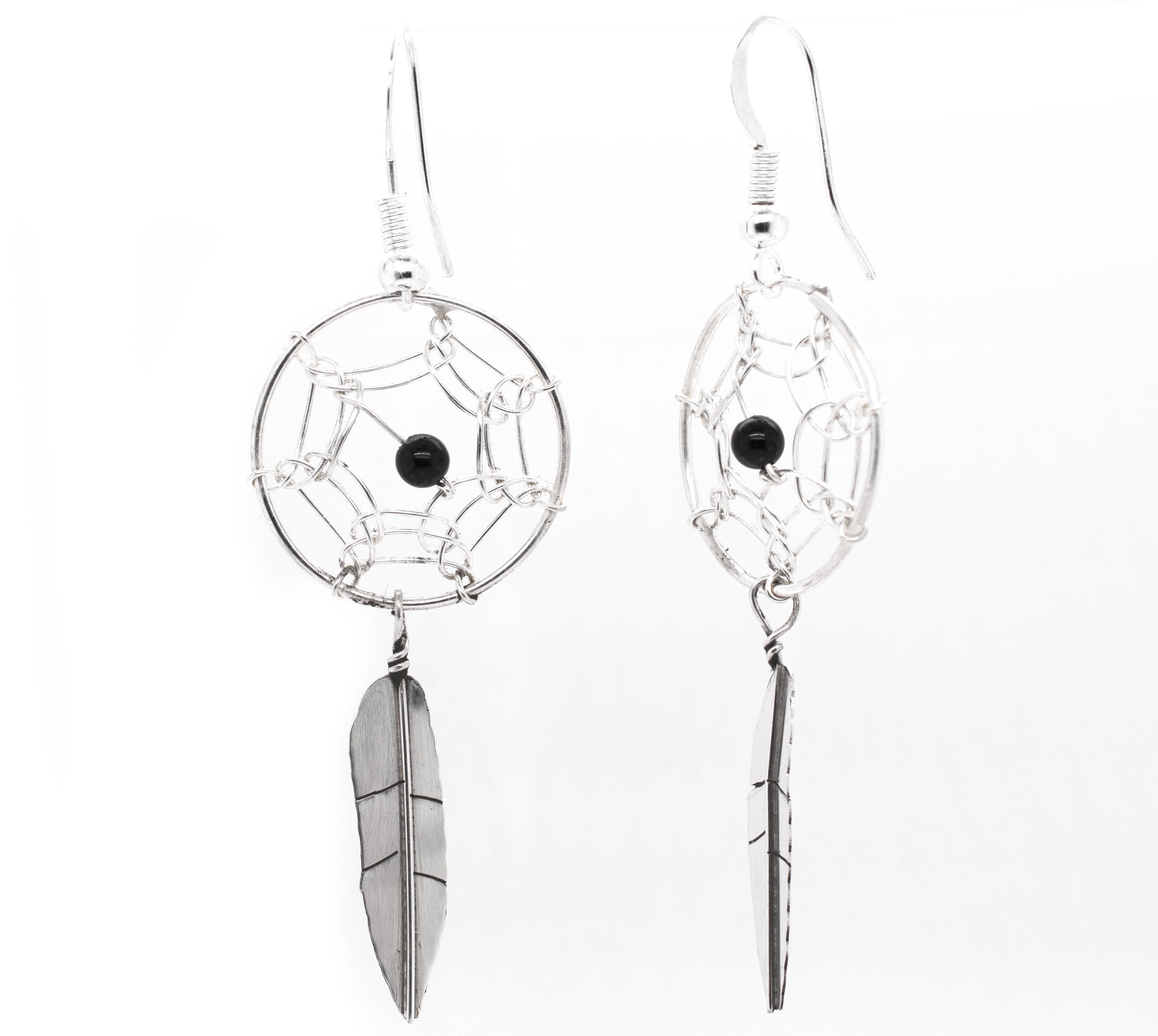 A pair of Super Silver Zuni Dreamcatcher Earrings with Natural Stone Bead and silver and black feathers.