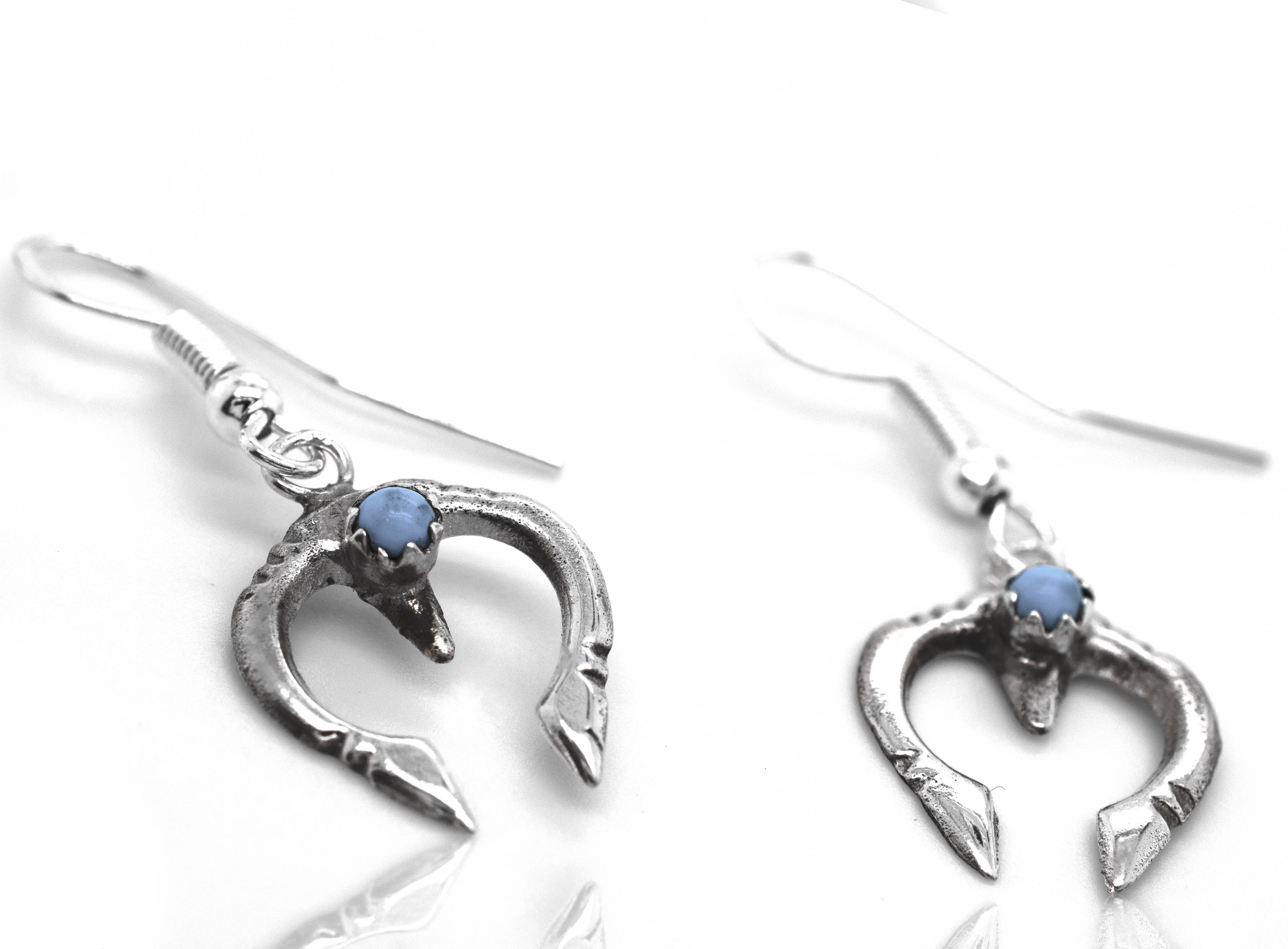 A pair of Dainty Naja Turquoise Earrings by Super Silver.