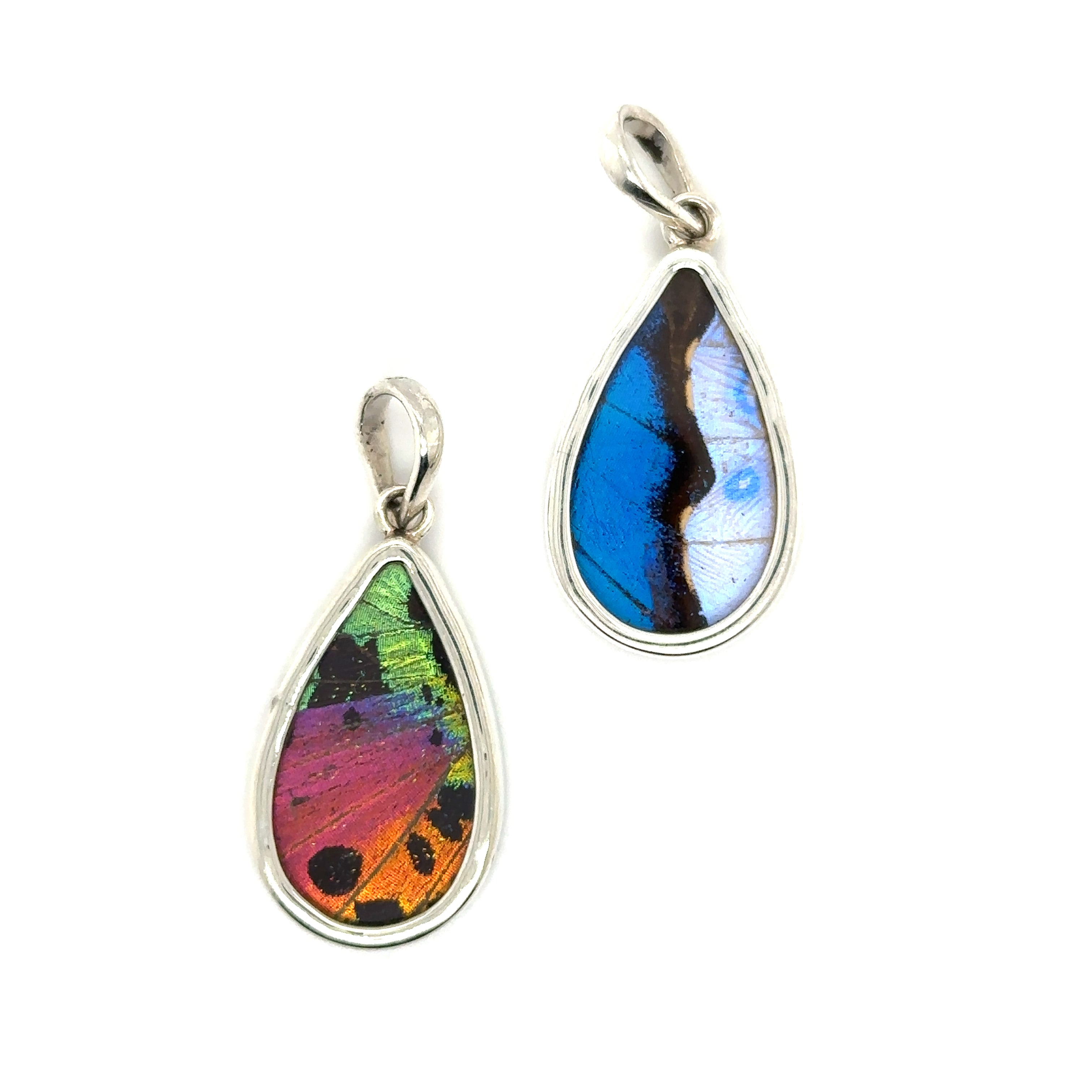 Two Genuine Butterfly Pendant and Earring Teardrop Sets on a white background.