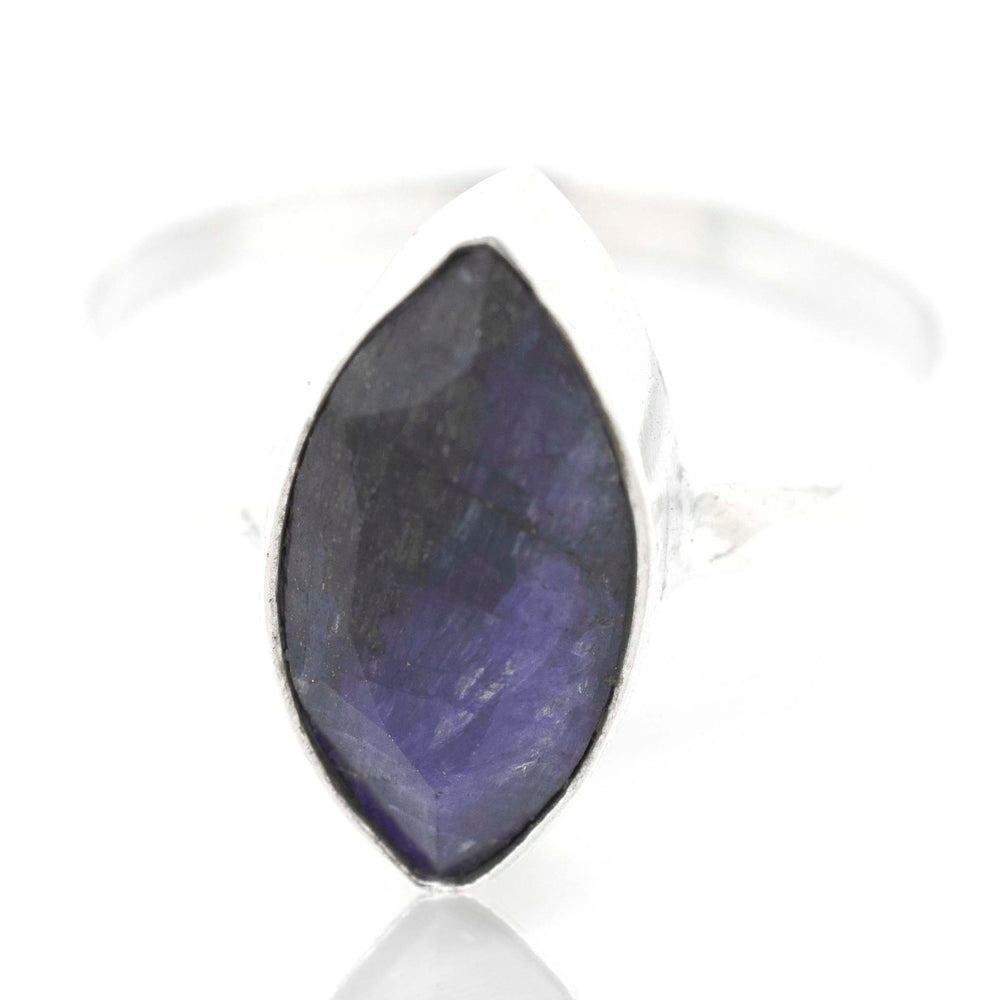 
                  
                    An indie Simple Marquise Shaped Gemstone Ring with a blue sapphire stone.
                  
                