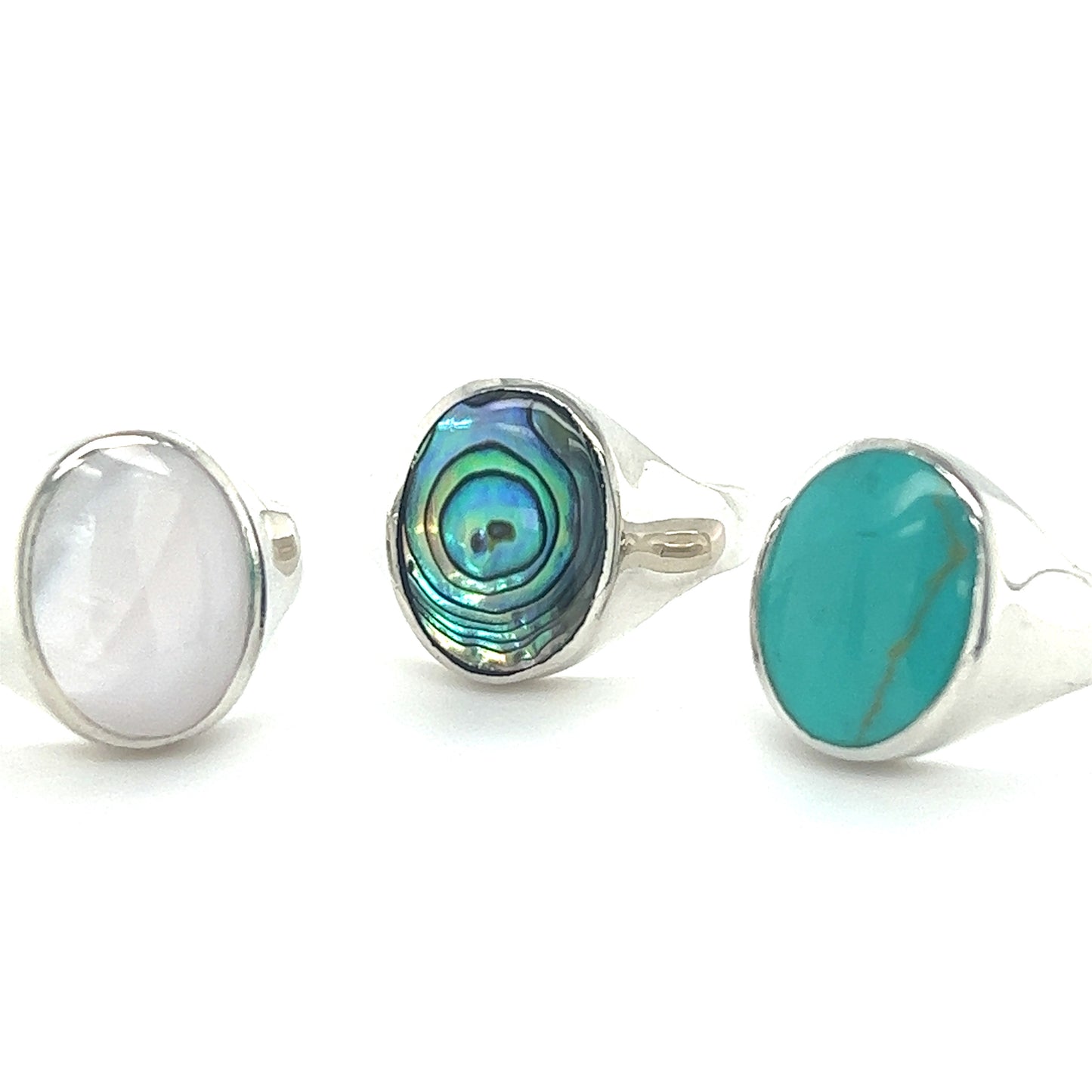 
                  
                    Three Super Silver Sleek Oval Inlaid Stone Signet Rings with turquoise and abalone stones.
                  
                