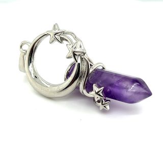 
                  
                    A Moon and Stars Crystal Pendant by Super Silver, featuring an amethyst stone with stars, imbued with the healing properties of the universe.
                  
                