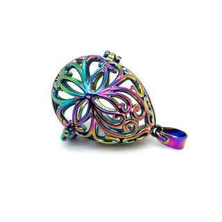 
                  
                    A colorful Filigree Cage Pendant with a Bali cage design from Super Silver.
                  
                