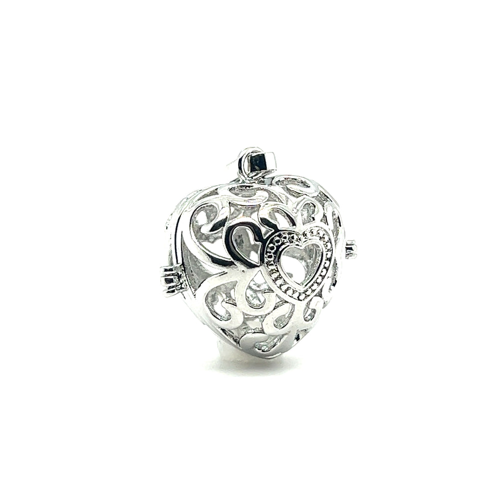 
                  
                    A Filigree Cage Pendant from Super Silver on a white background, exuding a boho vibe.
                  
                